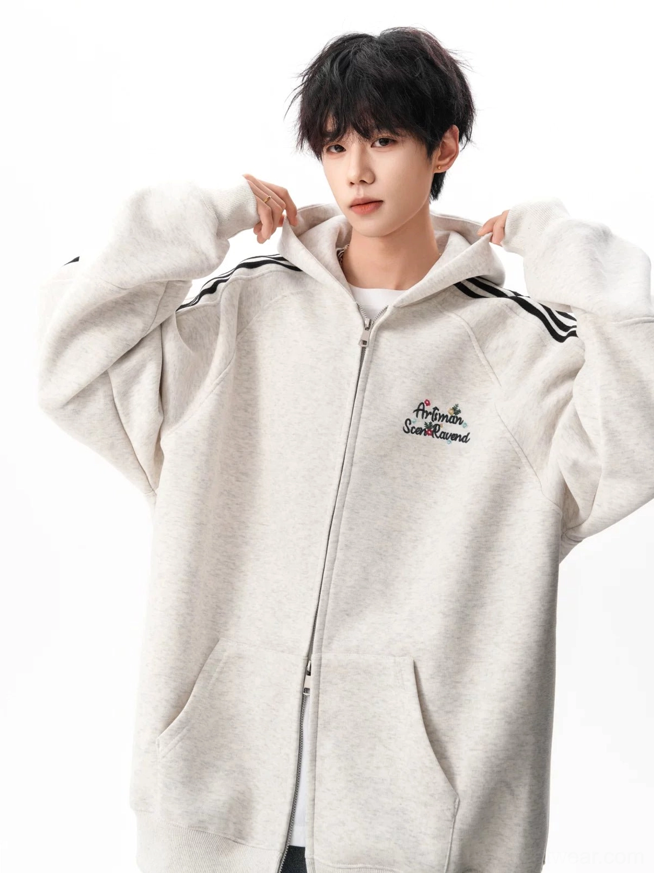 Triple stripe zip-up hoodie product image with relaxed oversized silhouette, hooded construction, and casual urban streetwear styling