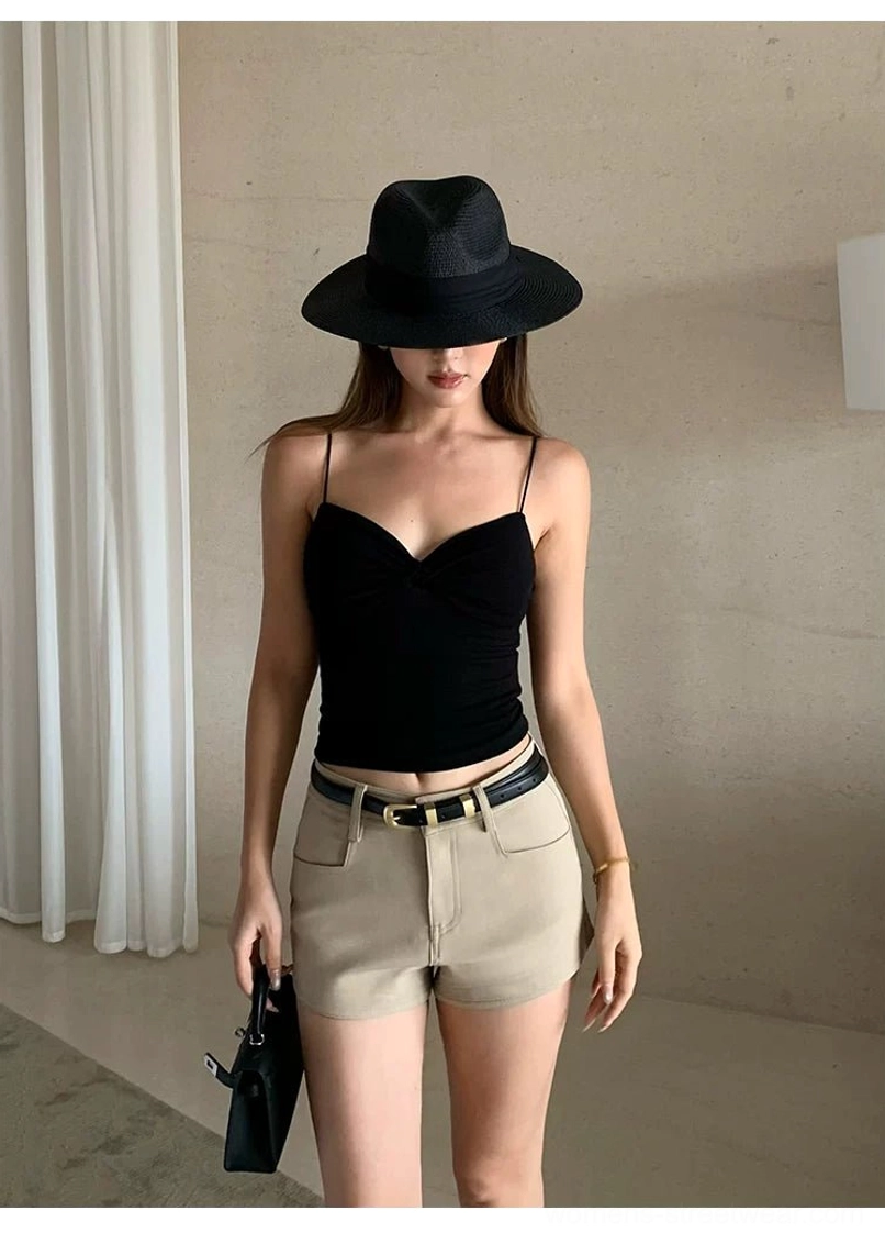 Black twist-front backless crop cami styled with khaki shorts and leather belt