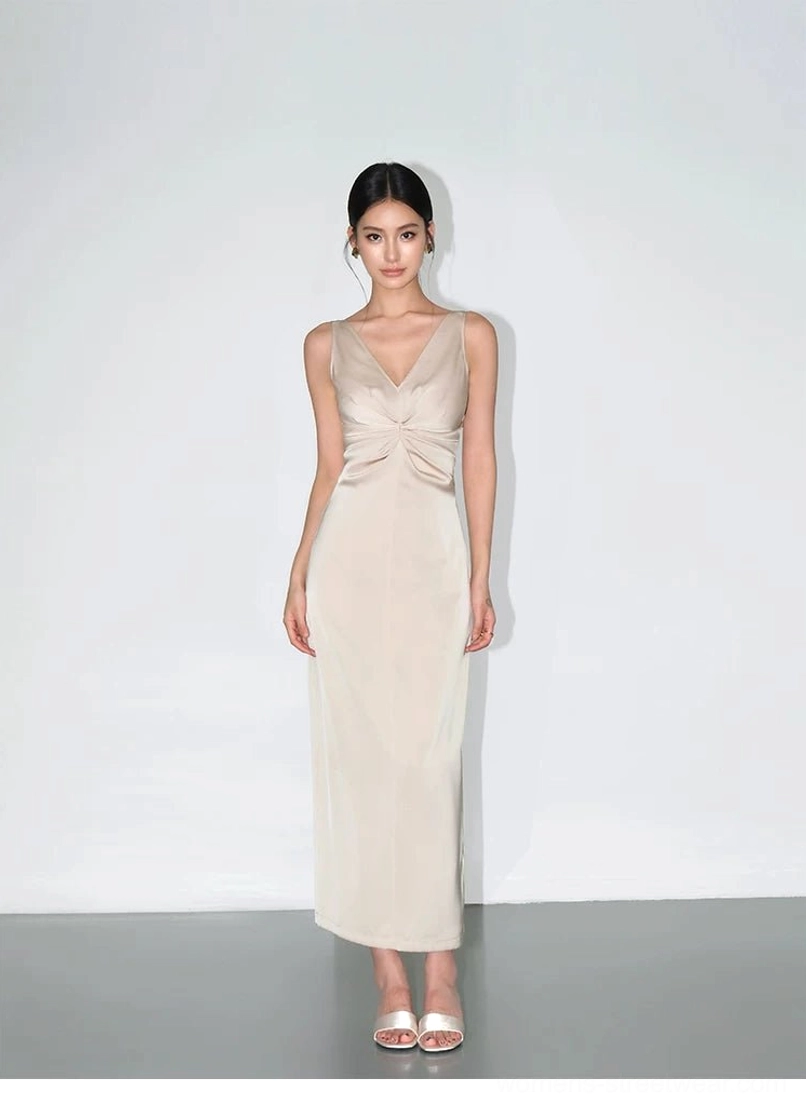 Champagne satin twist-front maxi slip dress shown in a full-body front view with V-neckline, sleeveless column silhouette and glossy ankle-grazing finish
