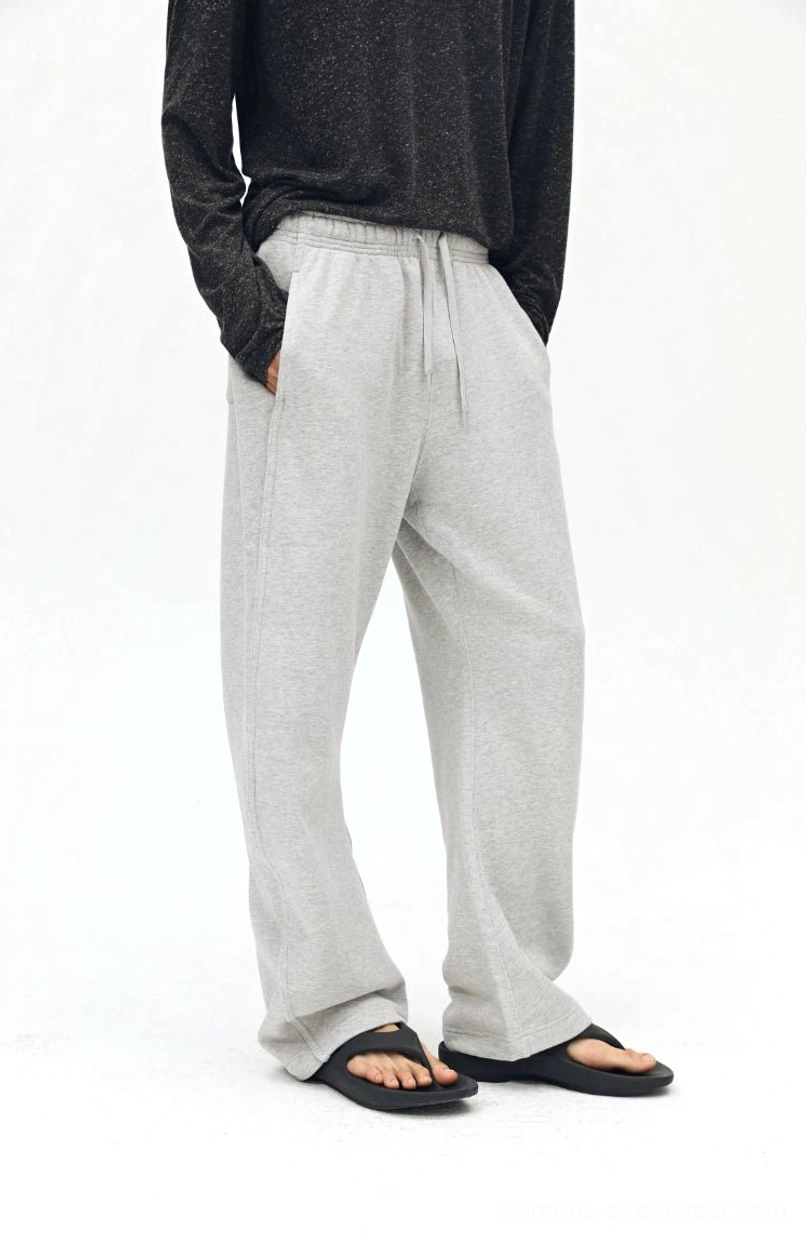 Twisted bone twill sweatpants detail shot - scimitar seam design close-up showing fabric quality