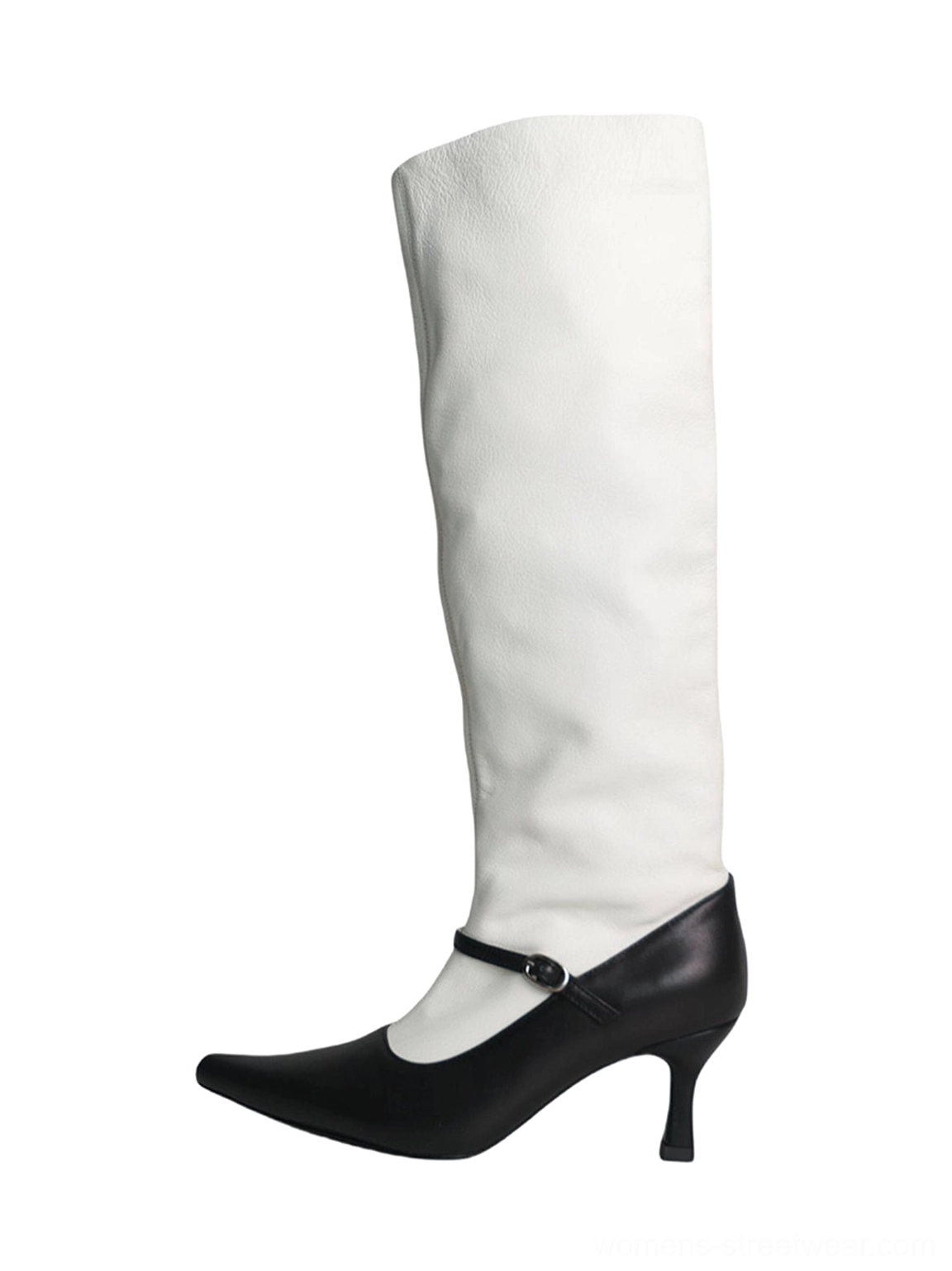 Front view of black and white two-tone pointed-toe knee-high streetwear boots with slouchy white shaft, black leather foot, ankle buckle strap, and slim curved heel