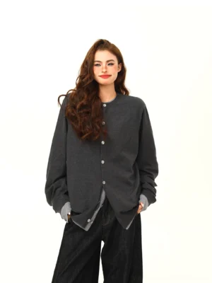 Front full-body view of a women’s two-tone gray asymmetric layered cardigan with oversized Korean streetwear fit and long sleeves