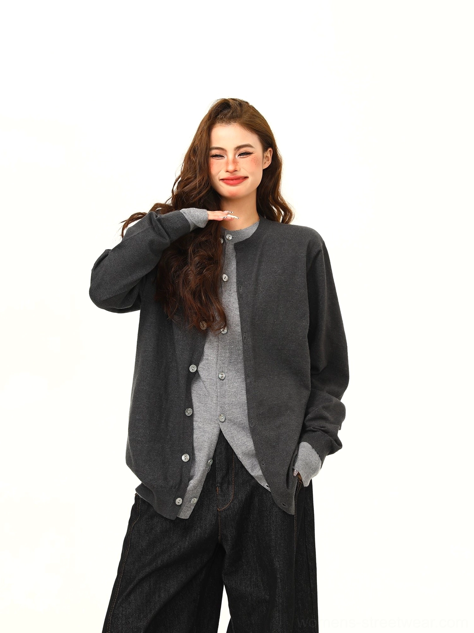 Front view of a two-tone gray button cardigan with relaxed drape, subtle letter accents, and modern Seoul street style