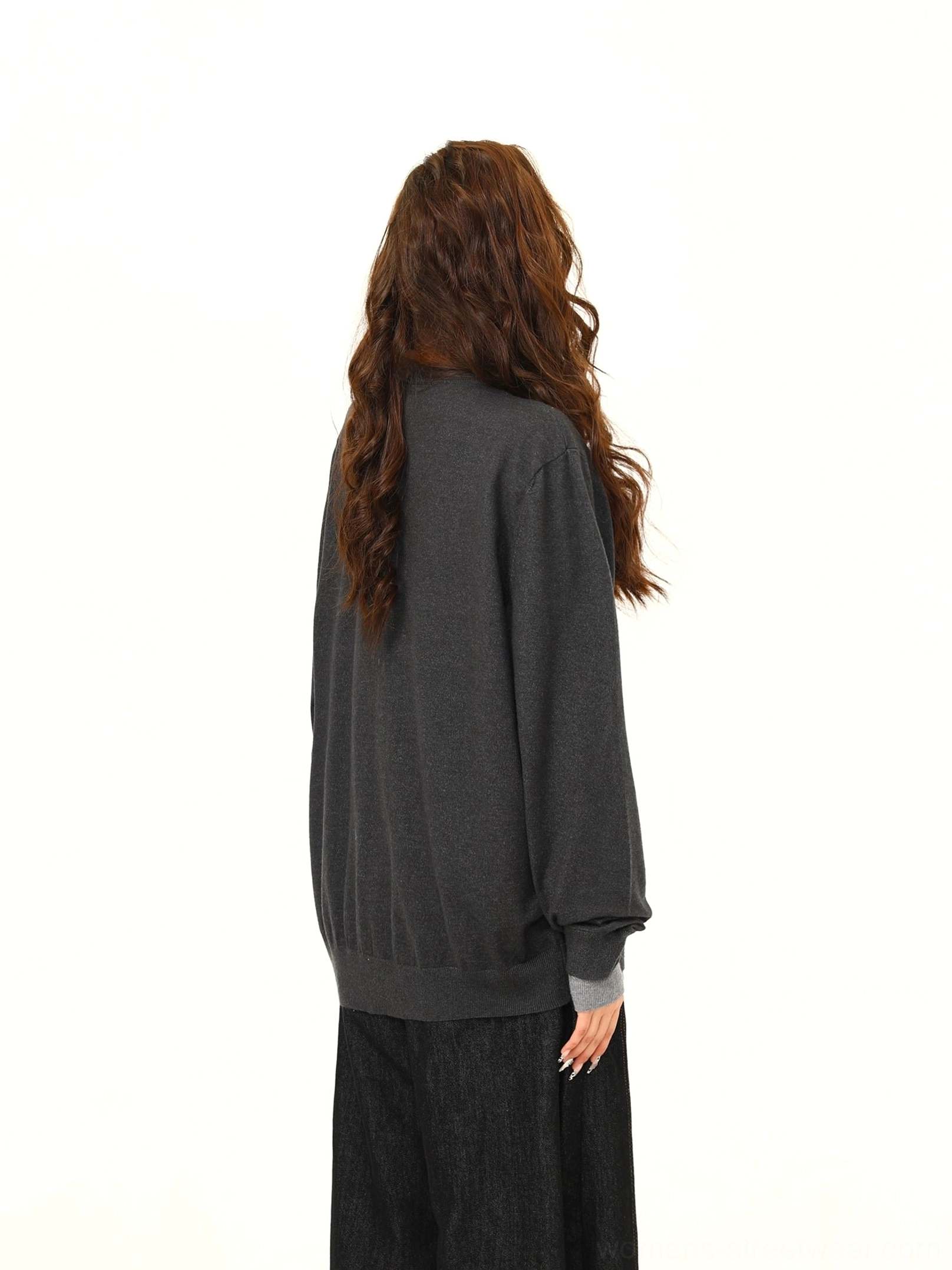 Back view of a women’s two-tone gray oversized cardigan showing the clean seamless back and relaxed fit