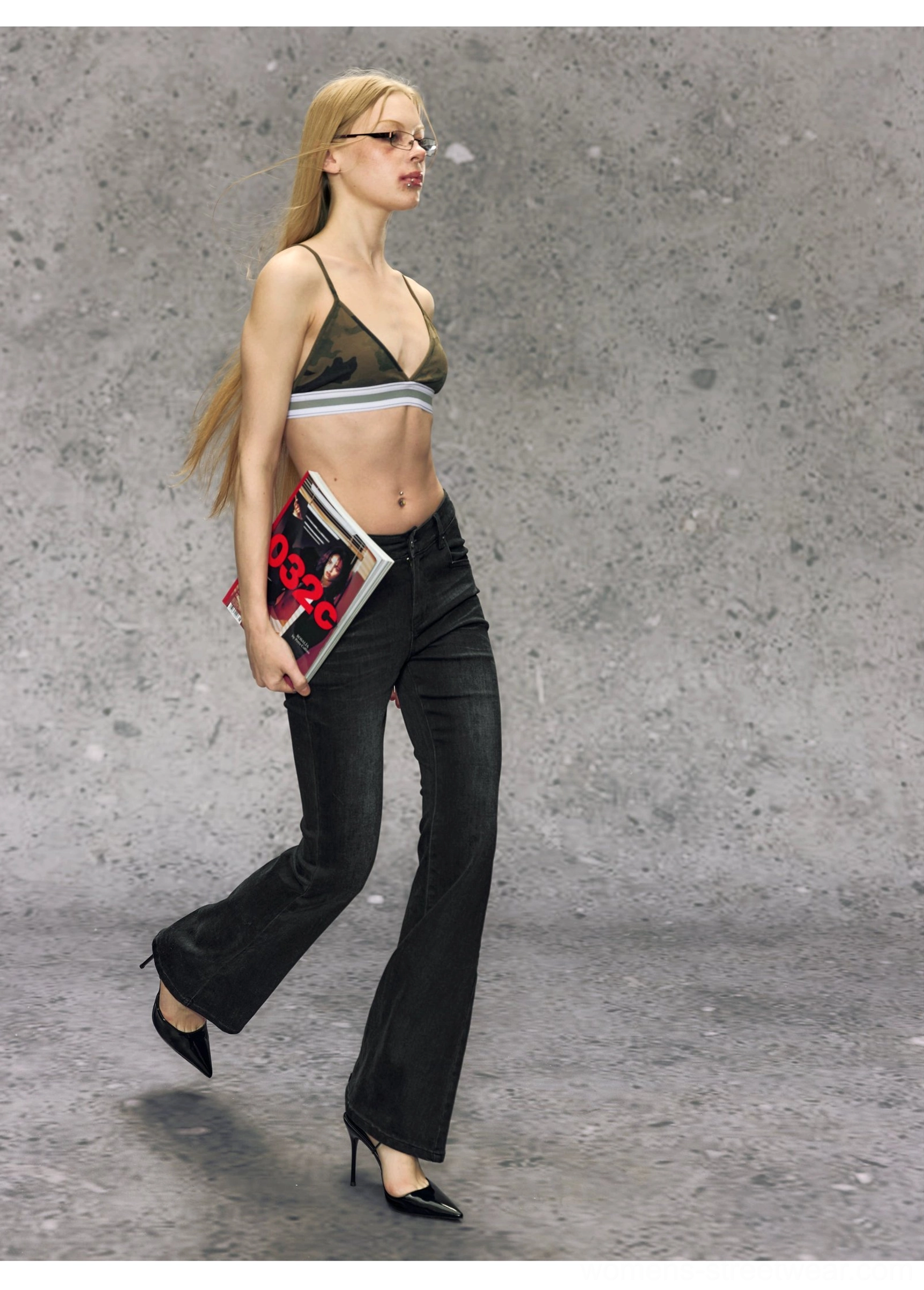 Gray black women’s micro flare jeans side walking view showing the fitted hip shape and subtle Y2K-inspired flare