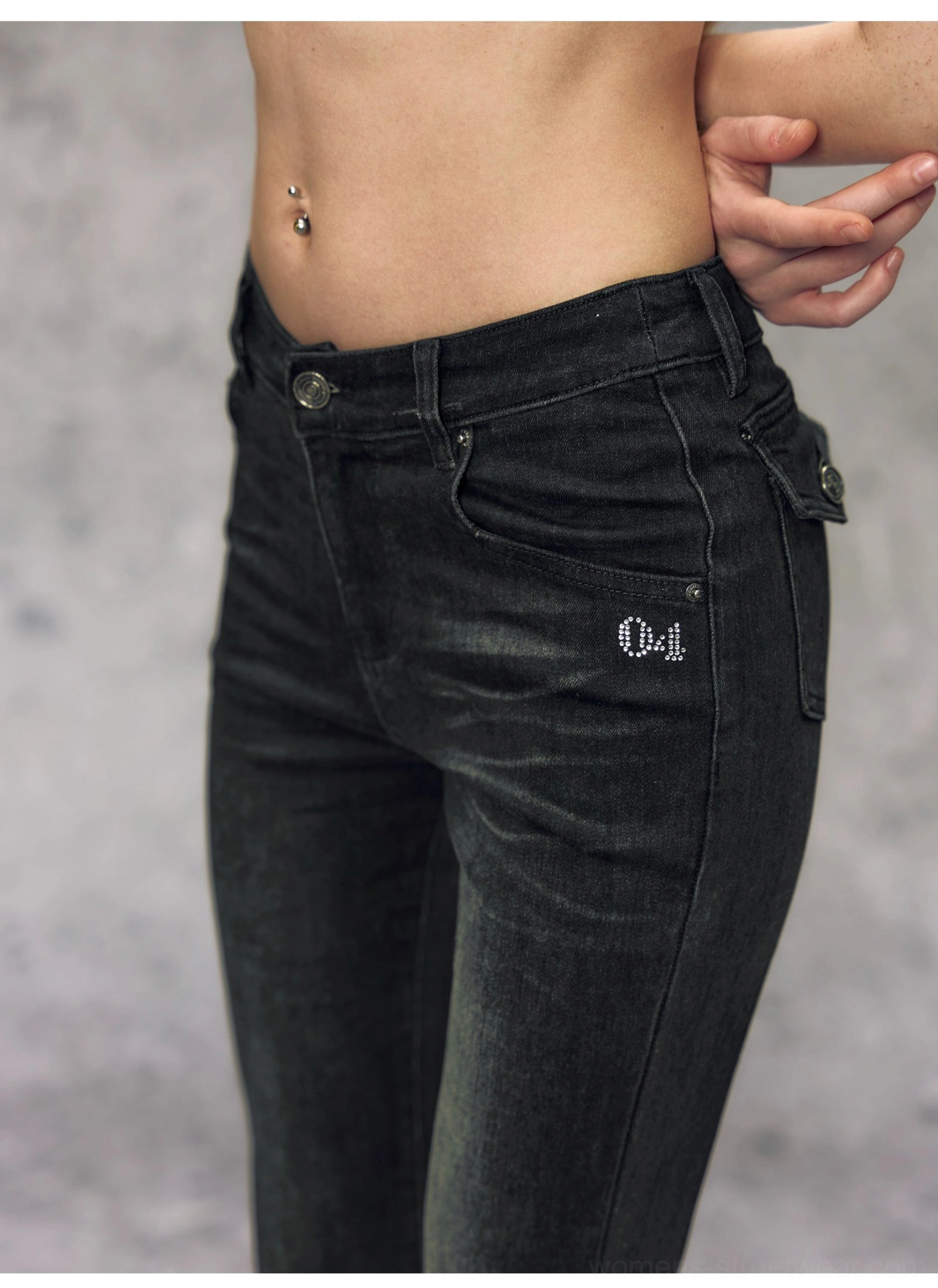 Two-tone high-waisted micro flare jeans detailed product view highlighting the slim-fit washed denim streetwear silhouette