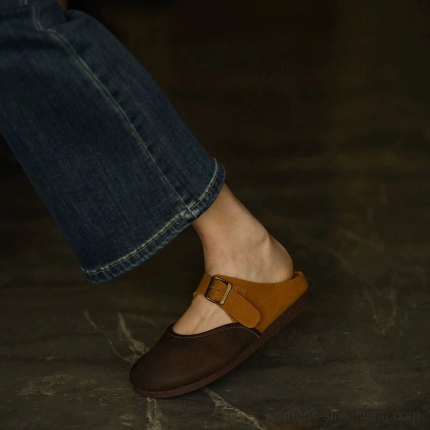 Two-tone leather Mary Jane flats showing rounded toe shape and low-profile flat sole