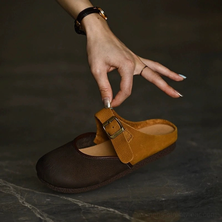 Two-tone leather Mary Jane flats with adjustable metal buckle and contrast tan strap detail