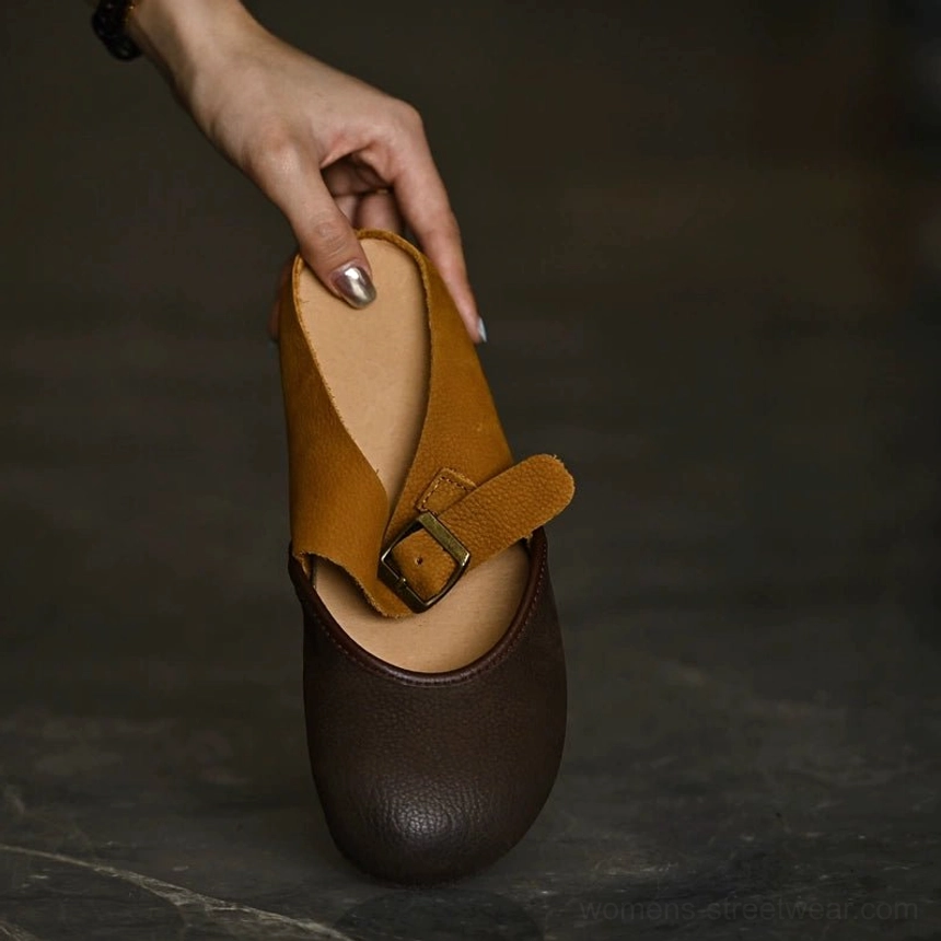 Two-tone leather Mary Jane flats product detail view with vintage-inspired buckle strap design