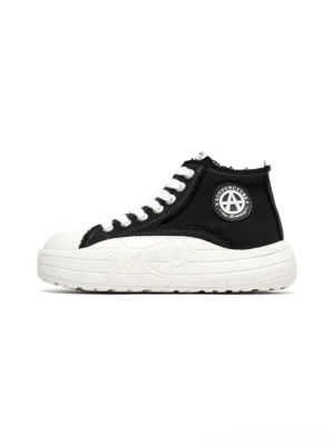 Two-tone platform canvas high-top sneakers black and white colorway side profile view showing contrast upper and thick white sole streetwear design