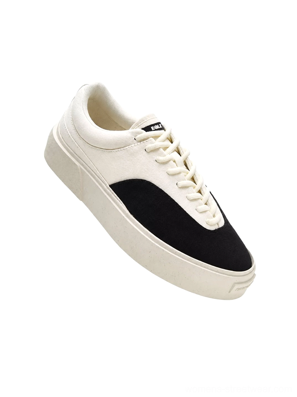 Two-tone platform canvas sneaker with a contrasting dark suede-style toe cap, off-white textile upper, tongue label, and thick creamy yellow rubber outsole