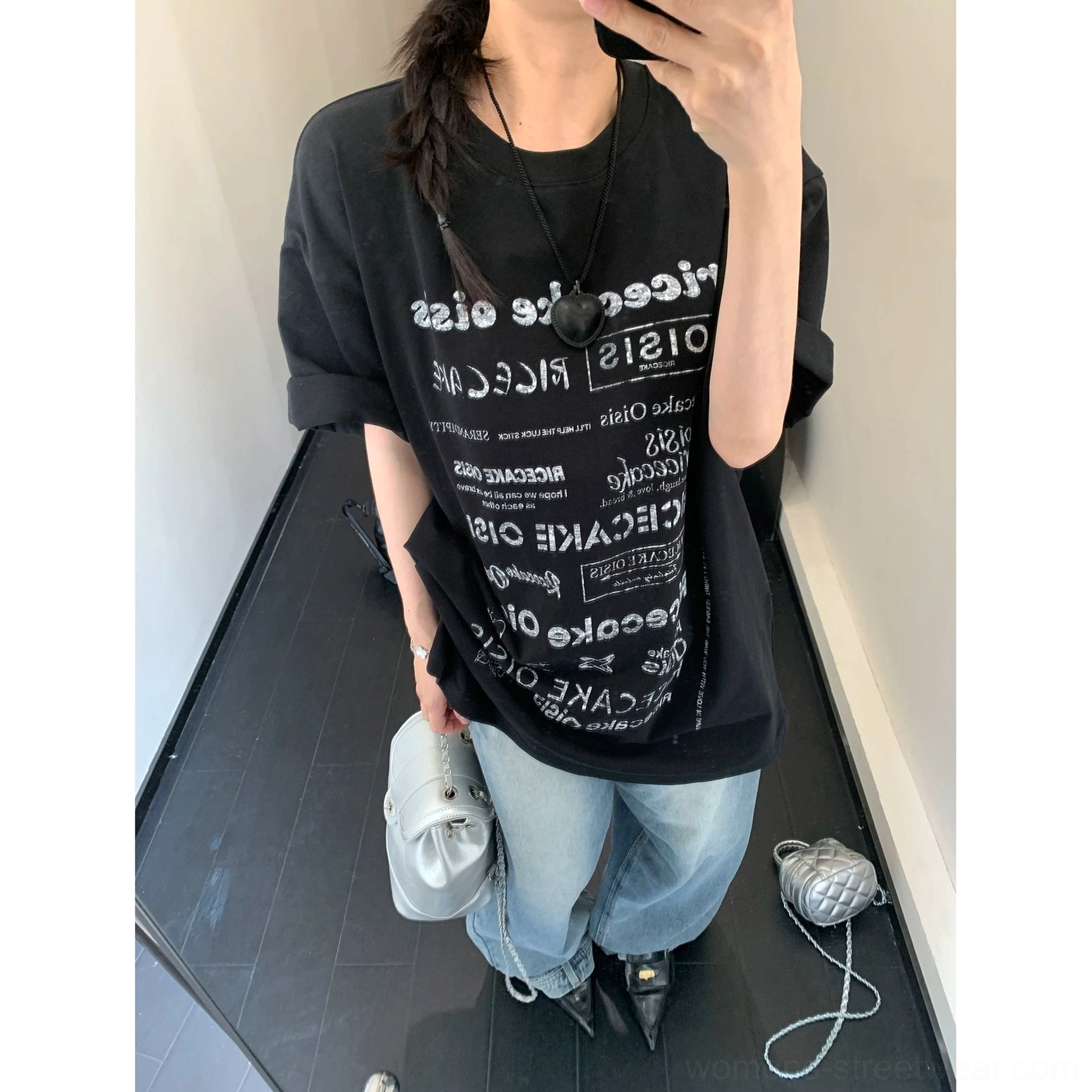 Black oversized graphic print crewneck t-shirt back outfit view paired with wide-leg denim and heels