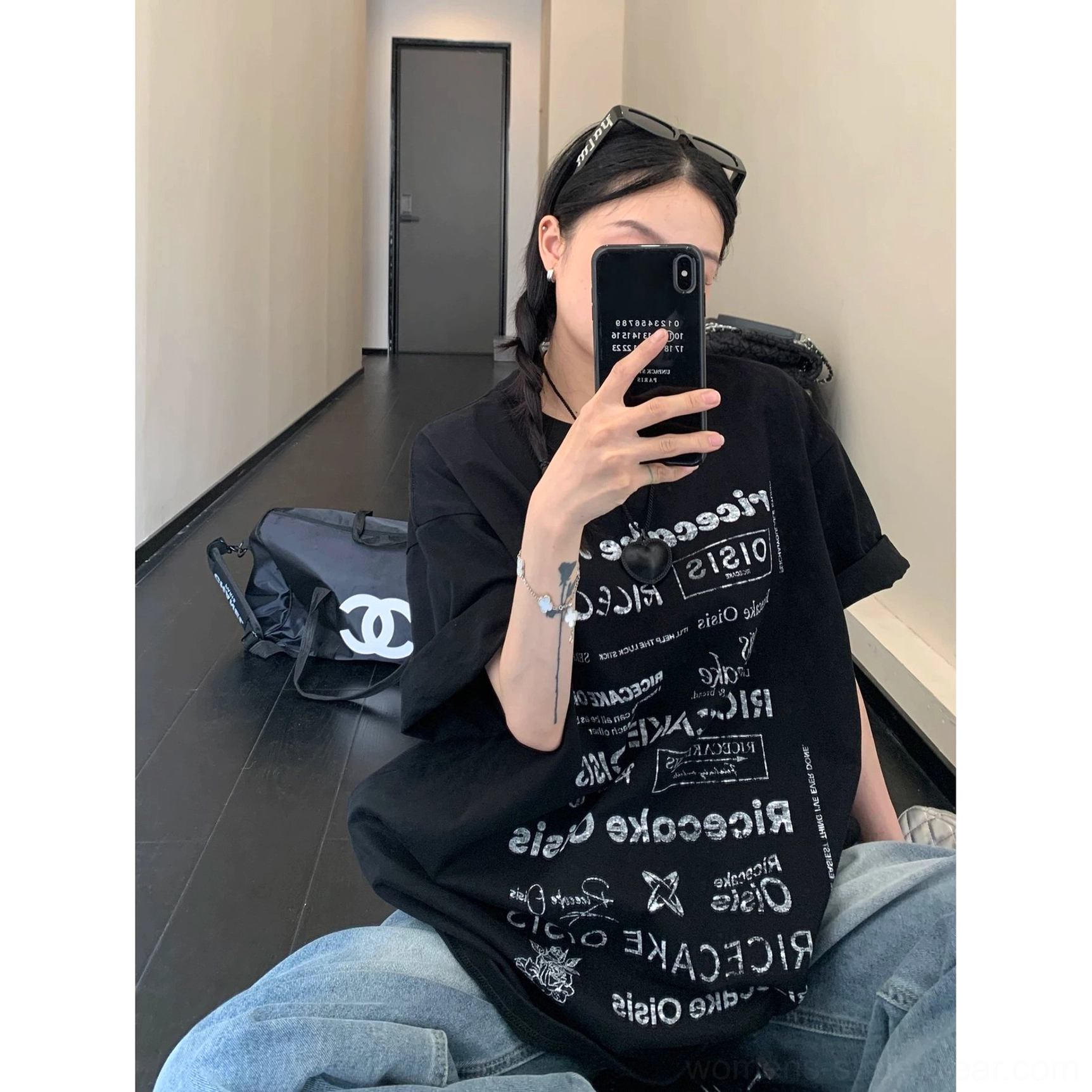 Black all-over typography oversized t-shirt with wide dropped sleeves and relaxed streetwear fit