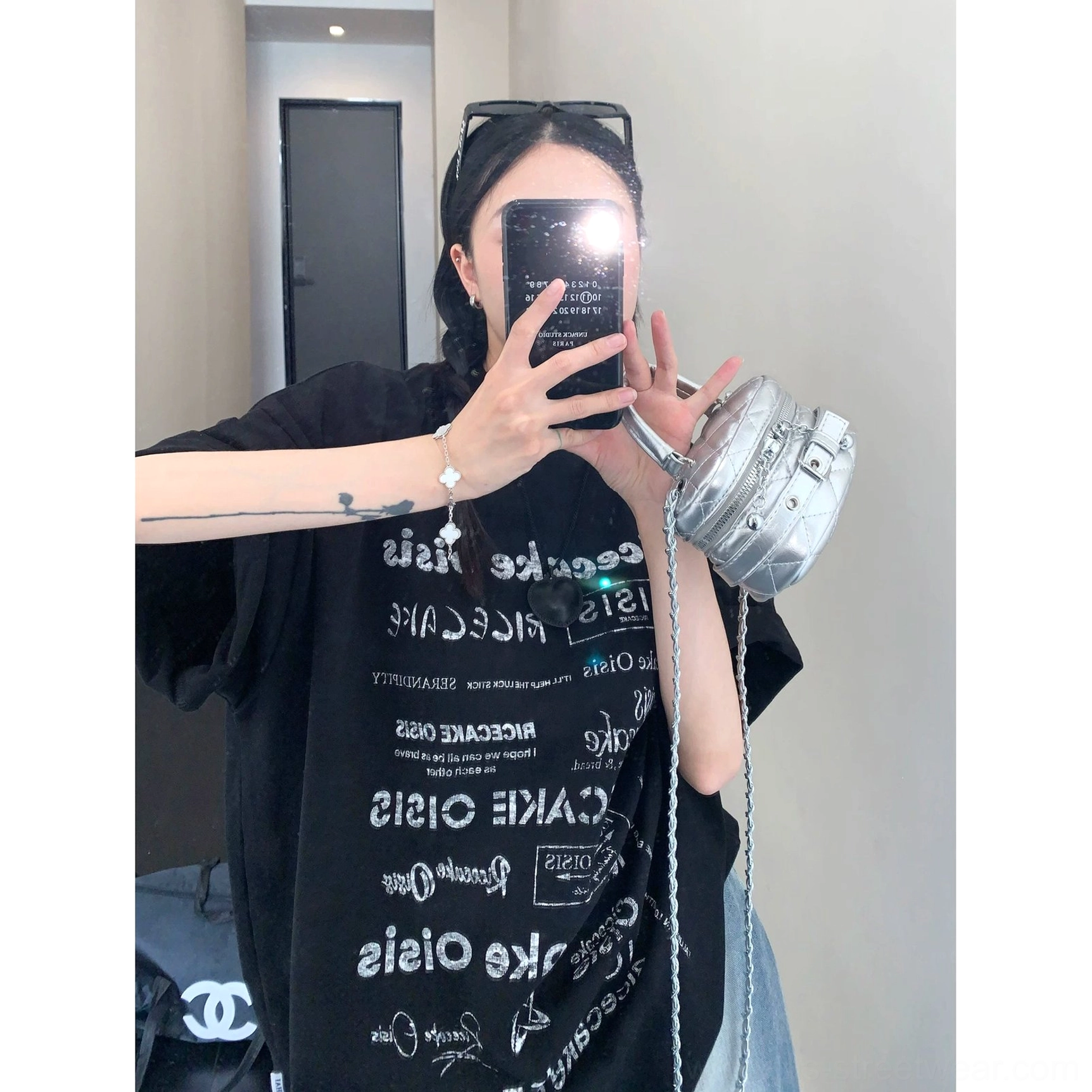 Black typographic riot oversized streetwear t-shirt with high-contrast all-over white text print
