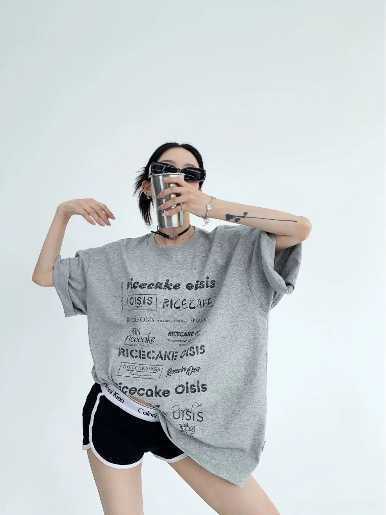 Heather gray typographic riot oversized streetwear t-shirt front view with white all-over text print