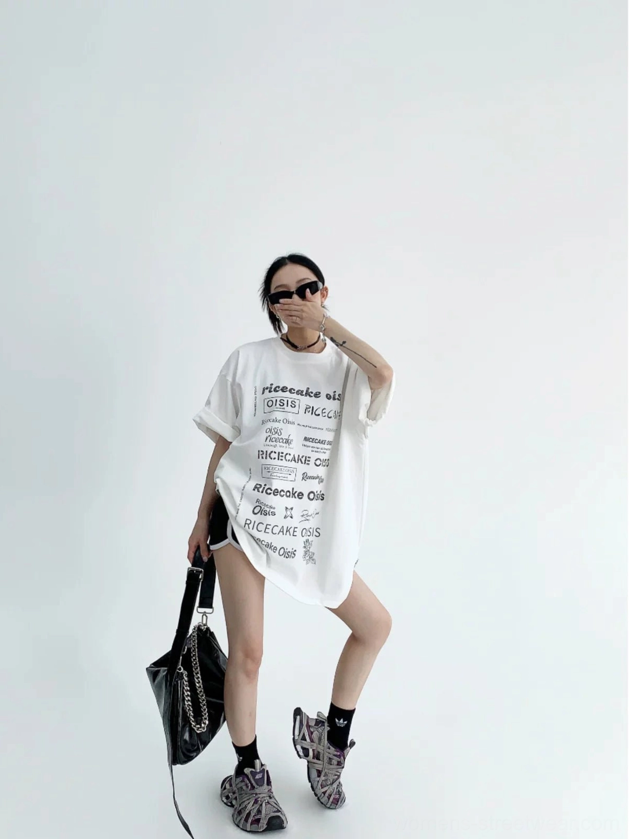 White oversized typographic streetwear t-shirt full body outfit view showing elongated loose silhouette