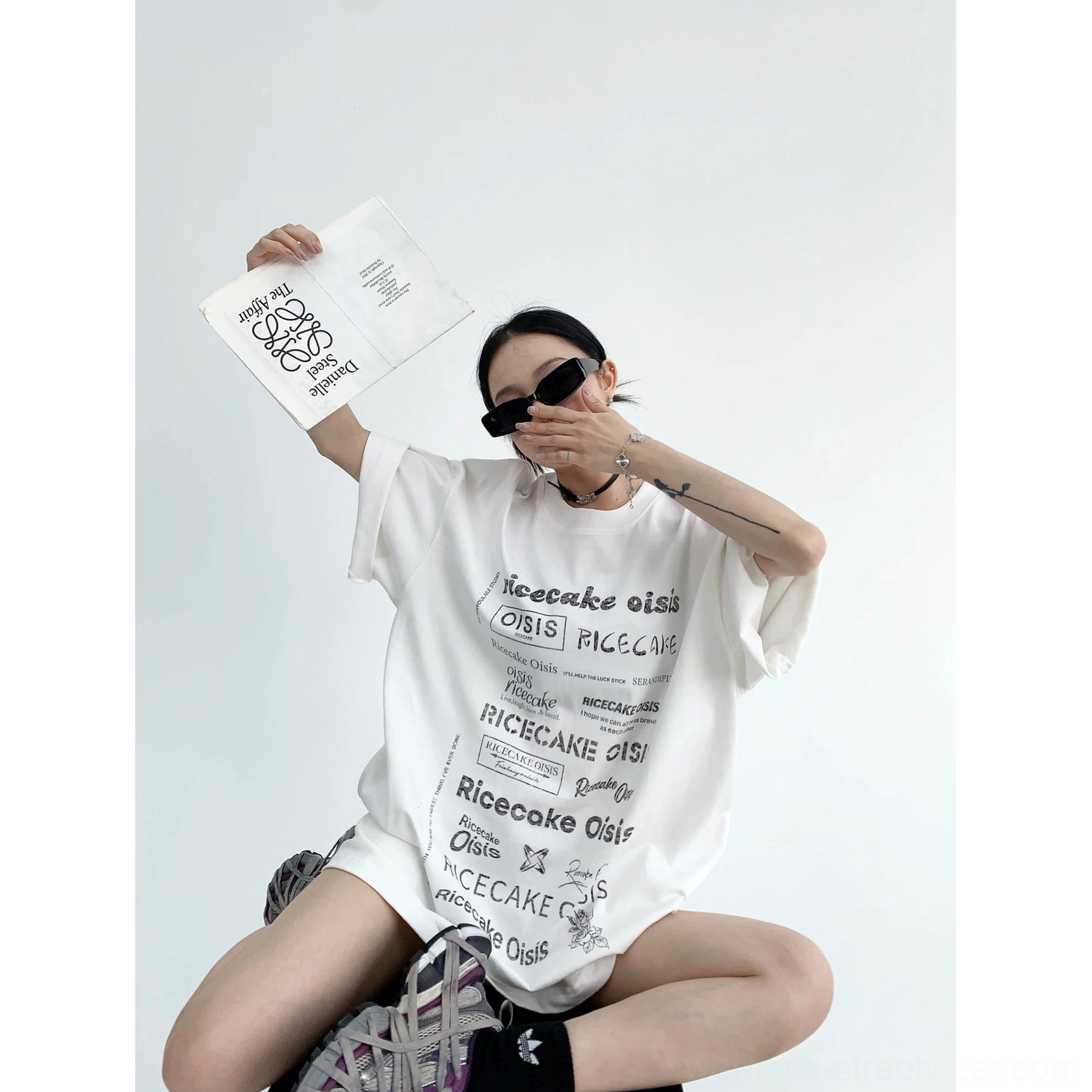 White typographic riot oversized streetwear t-shirt with contrasting black all-over lettering print