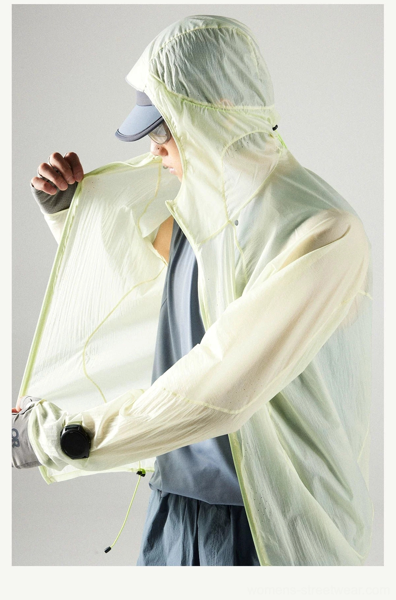 Side front view of the Lemon Green hooded sun protection windbreaker showing the full front zipper, adjustable hood, and lightweight translucent fabric