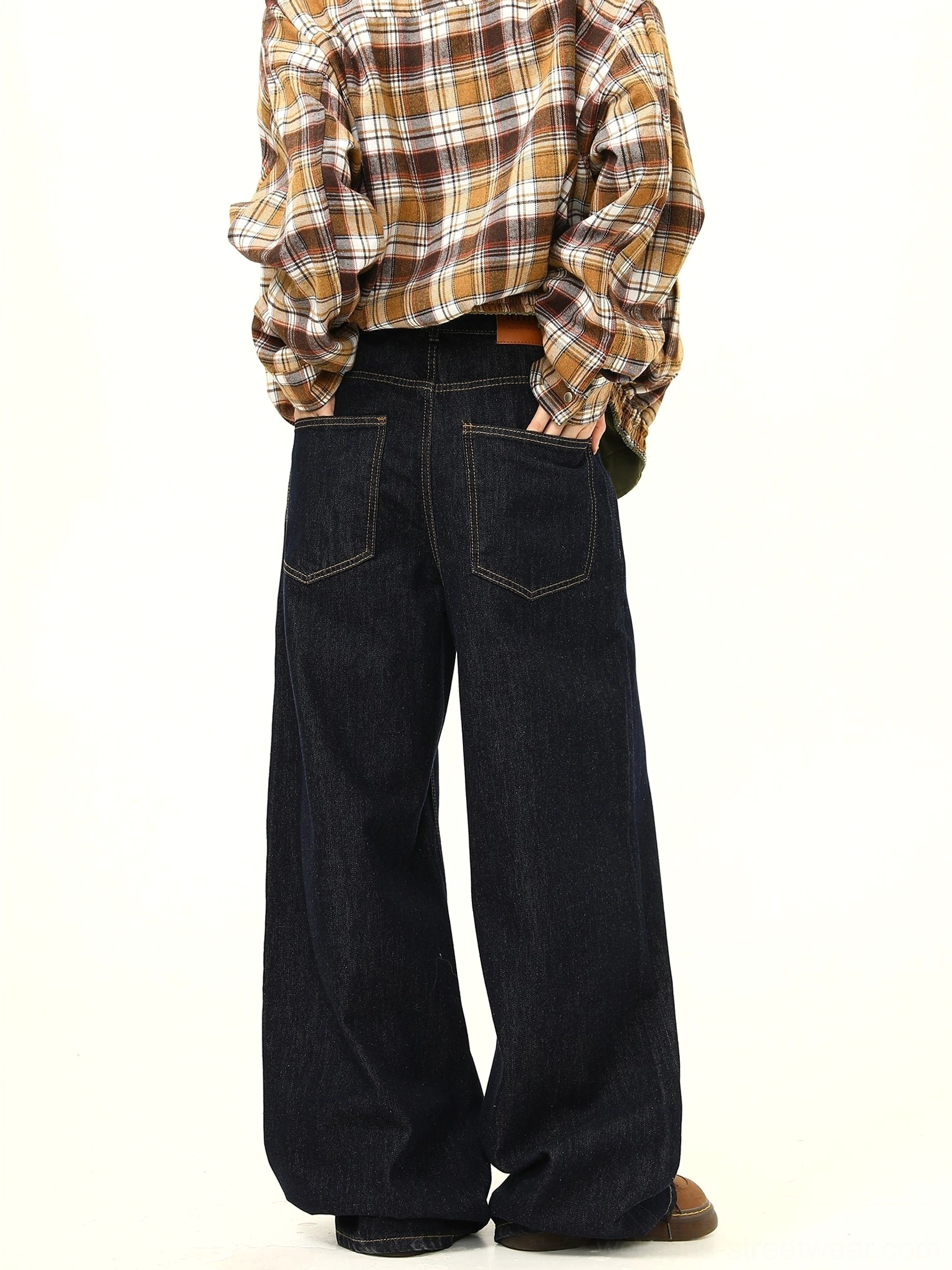 Rear view of ultra wide leg dark denim jeans with dual patch pockets and a clean relaxed streetwear fit