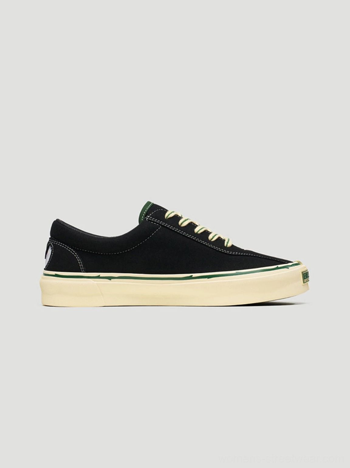 Unisex black low-top skate sneakers with rose embroidery styled as contemporary Seoul-inspired streetwear footwear