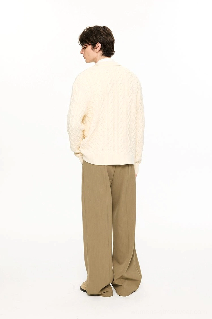 Unisex cable knit polo collar sweater detail showing double twist texture and button front placket