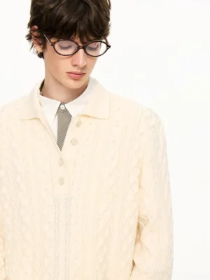 Cream cable knit polo collar sweater close-up layered over a formal shirt and tie in Korean streetwear styling