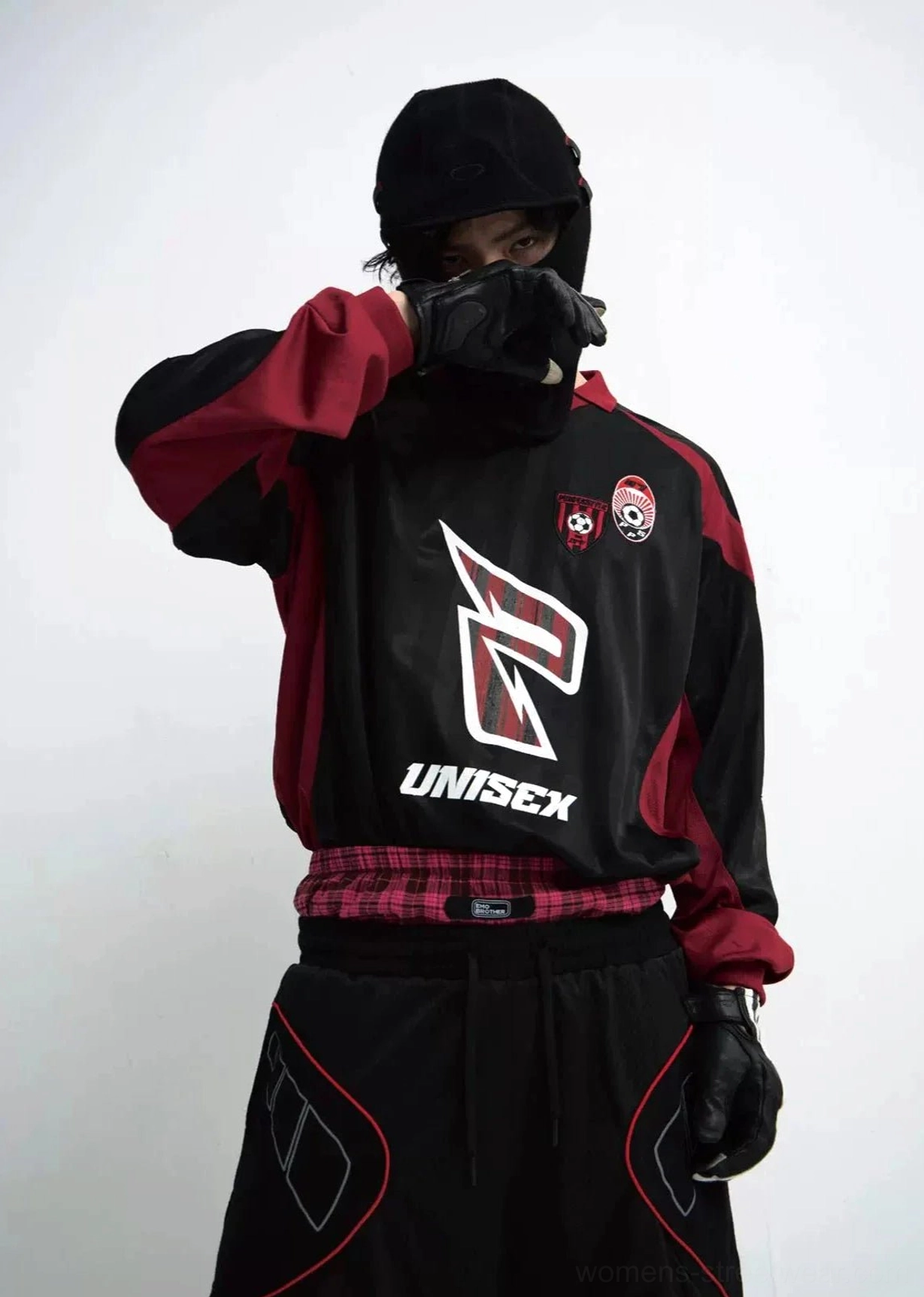 Unisex racing team color block streetwear sweatshirt in black and wine red worn by male model front three quarter view