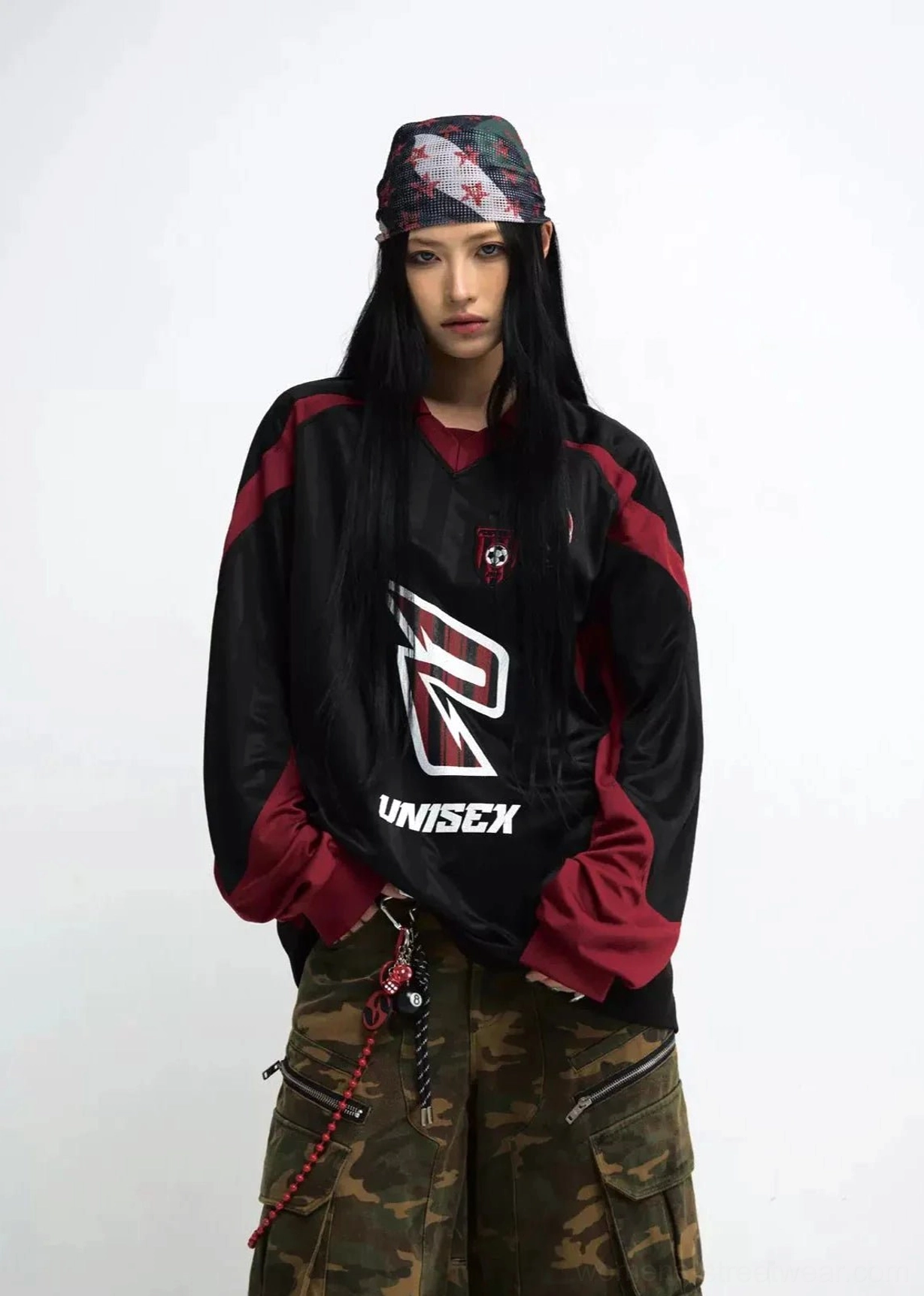 Unisex racing team color block sweatshirt styled with camouflage cargo shorts on female model front view