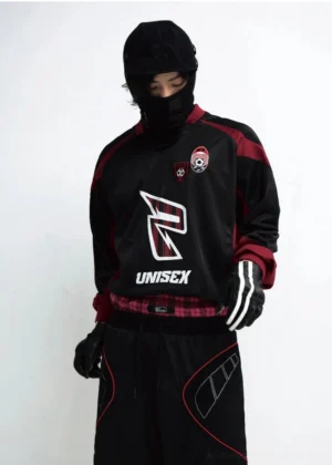 Black and wine red unisex racing team streetwear sweatshirt with graphic patches worn by male model full front view