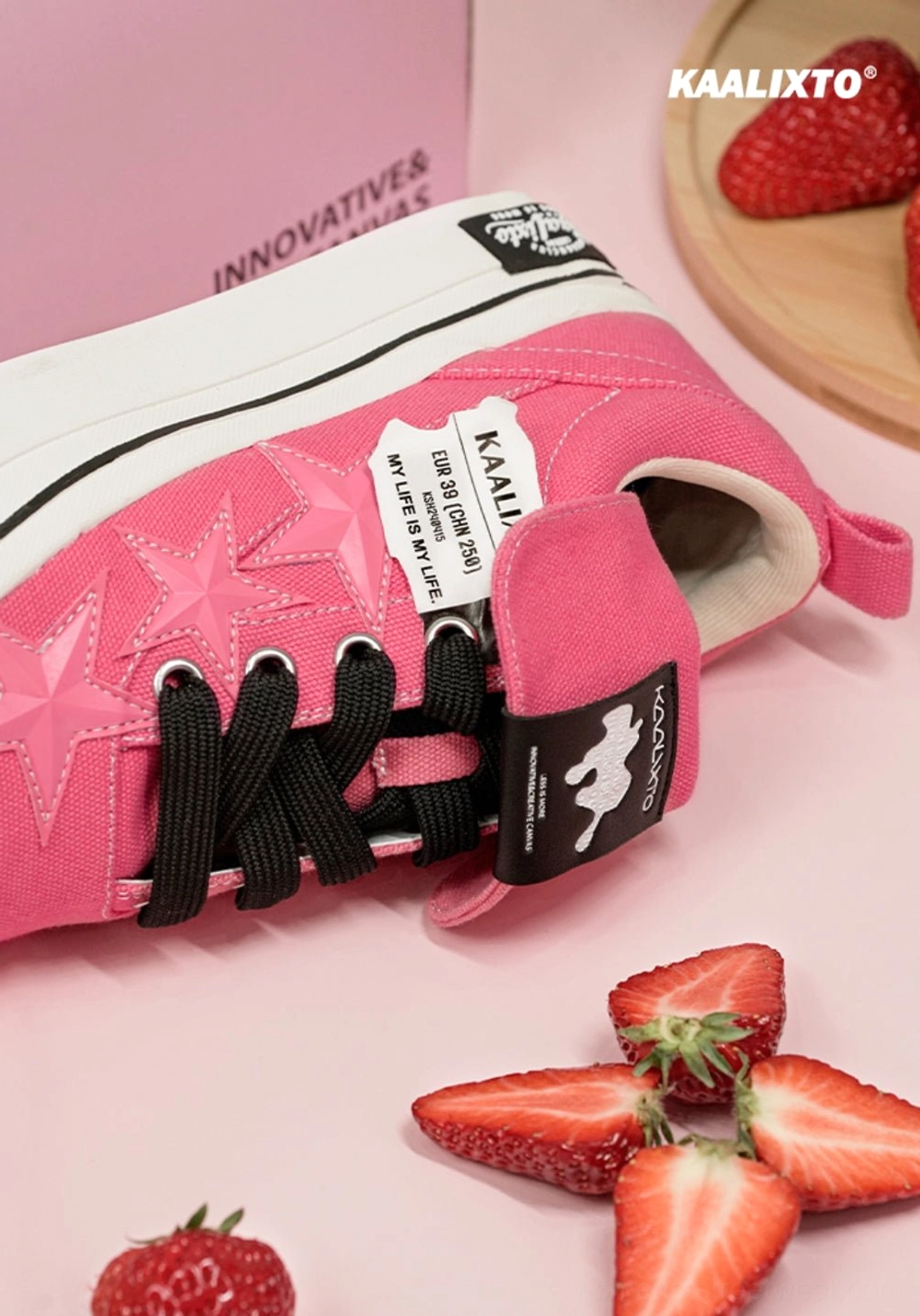 Unisex rose pink canvas platform sneakers with contrast black laces and graphic star side detail