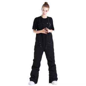 Black unisex waterproof utility bib snow pants shown in a full-body front studio view with adjustable suspenders and flared streetwear snow pants silhouette