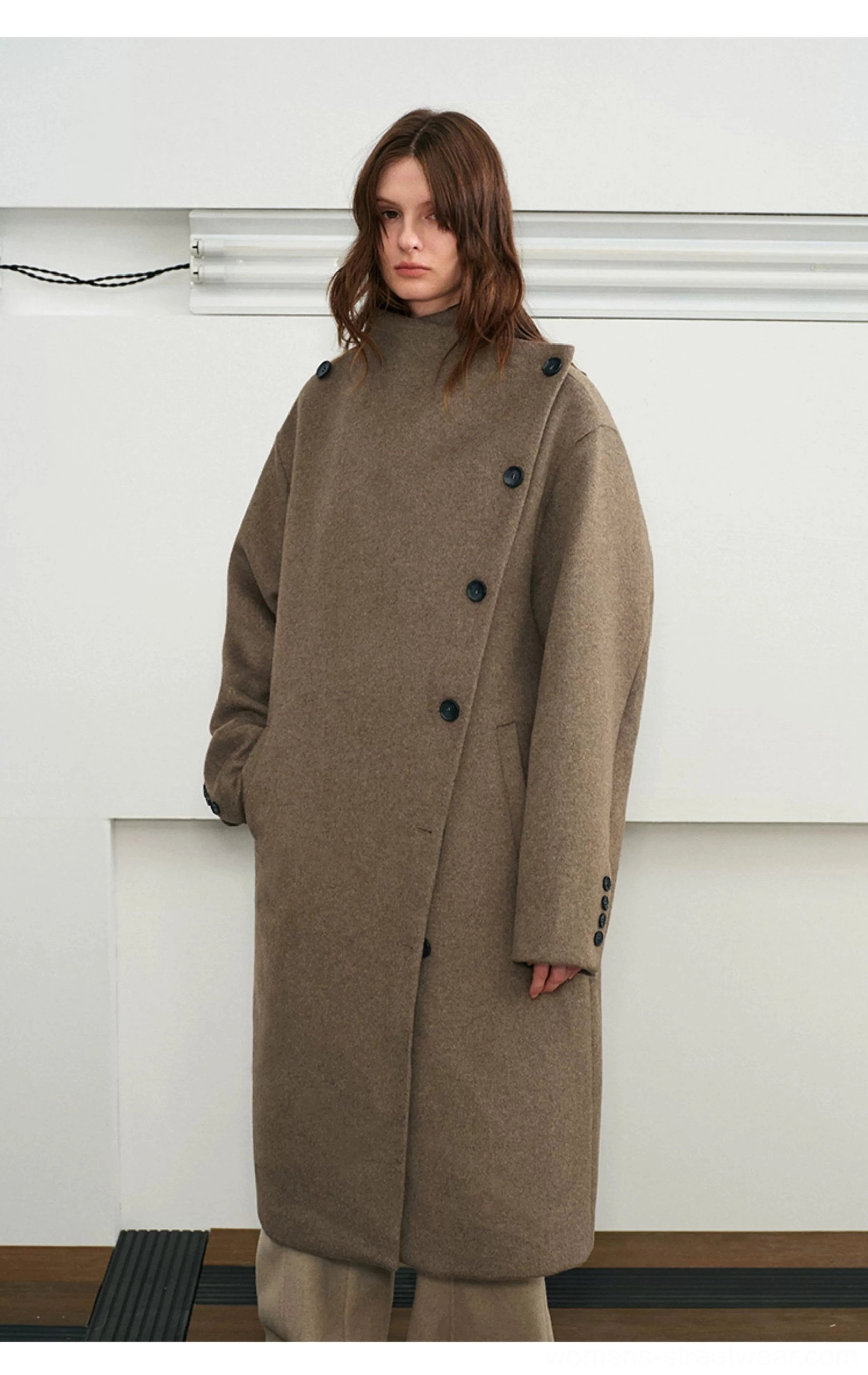 Brown wool blend long overcoat front view with stand collar and asymmetric button closure