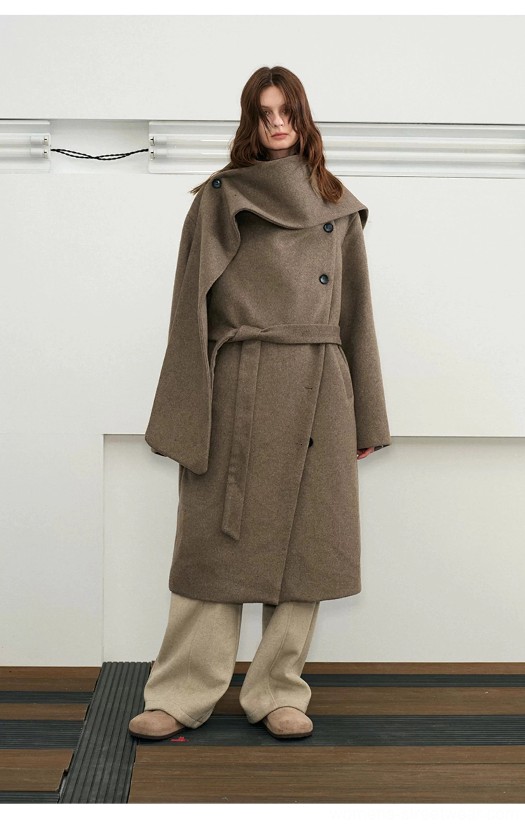 Brown belted wool blend cape collar long overcoat full body view with wide-leg trousers