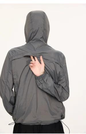 Dark gray lightweight UV protection hooded jacket shown from the back with adjustable hem streetwear fit