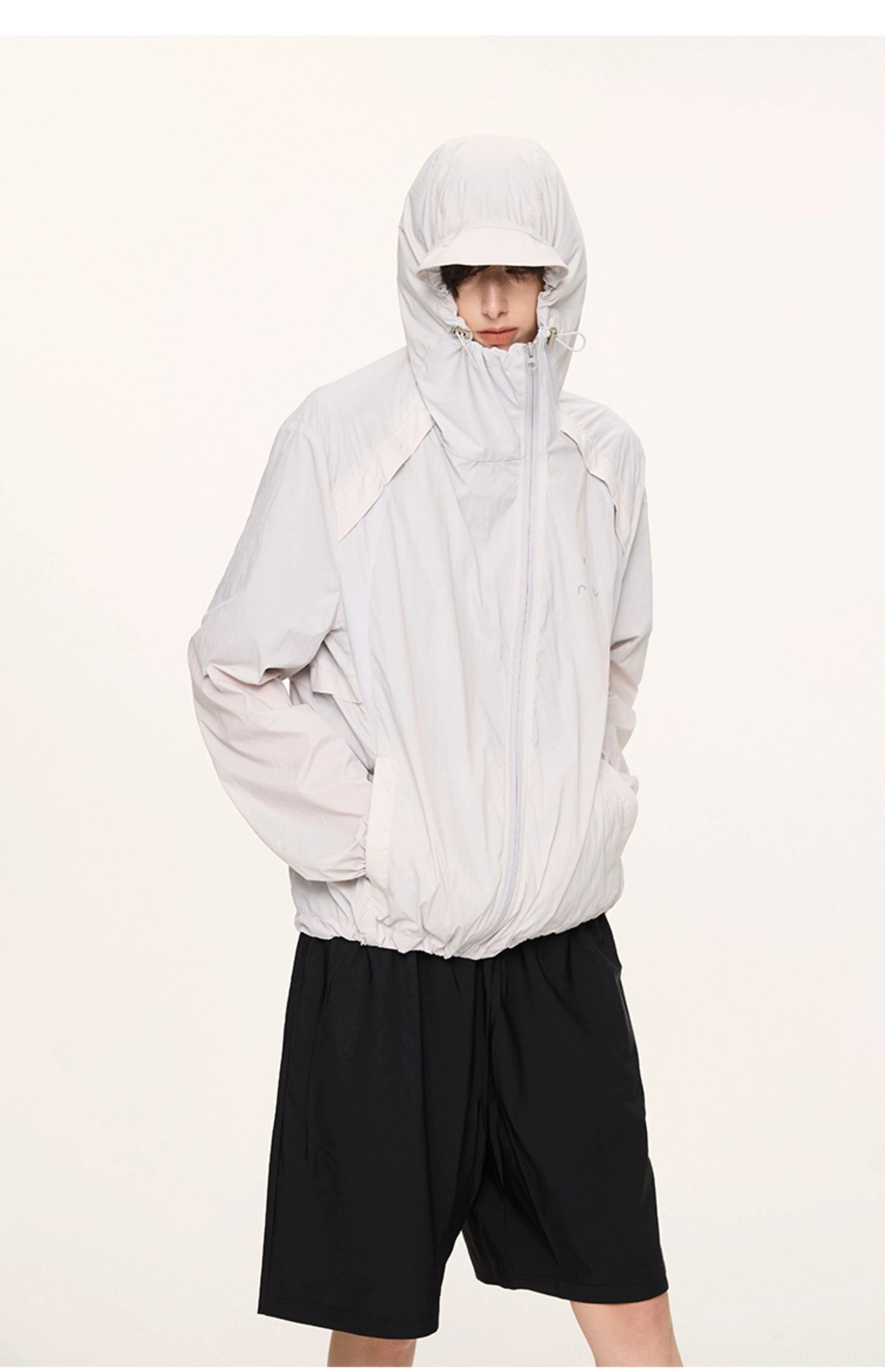 Light gray lightweight UV protection hooded jacket back view showing relaxed silhouette and adjustable hem
