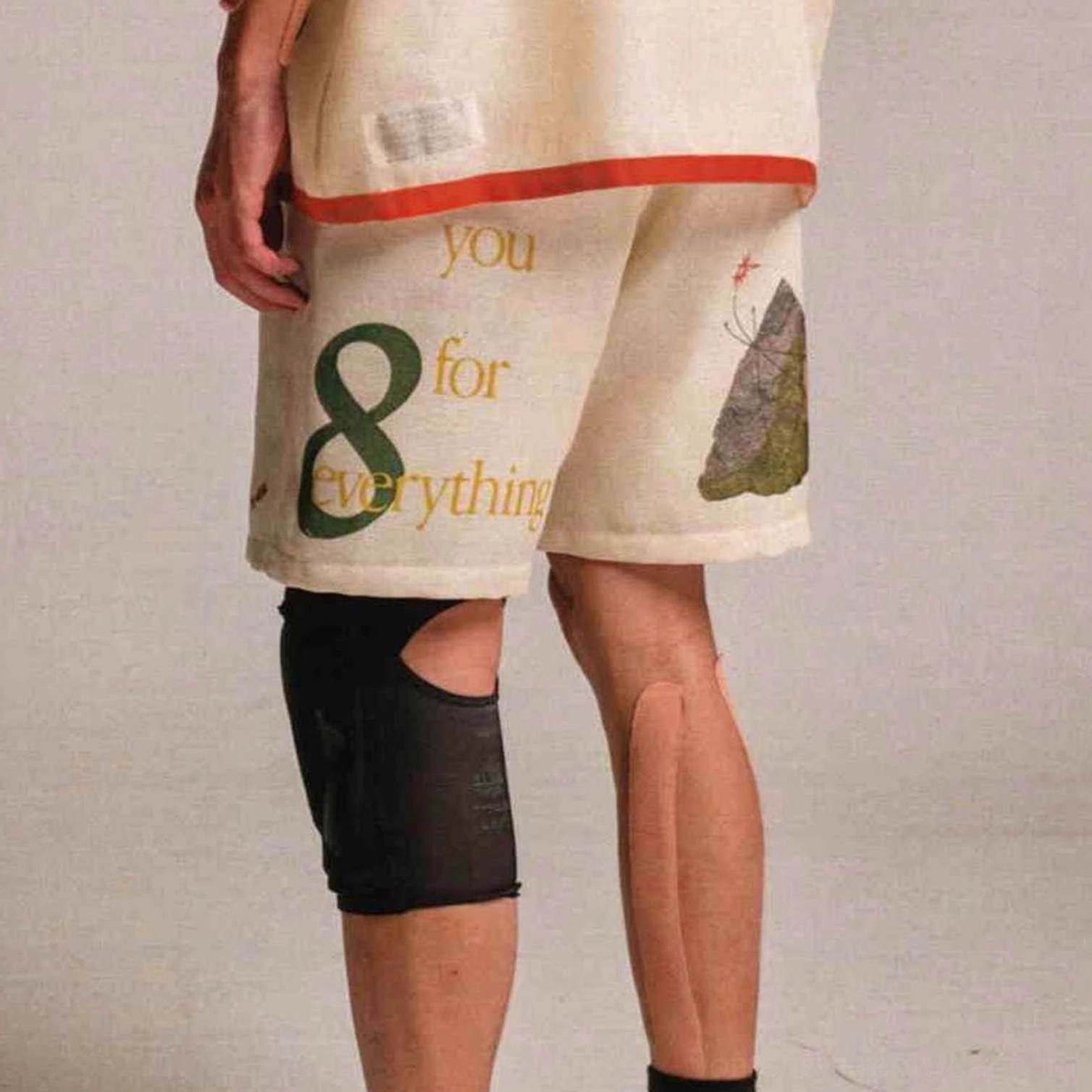 Apricot Urban Forest graphic sweat shorts side view with number 8 mountain print and relaxed streetwear silhouette