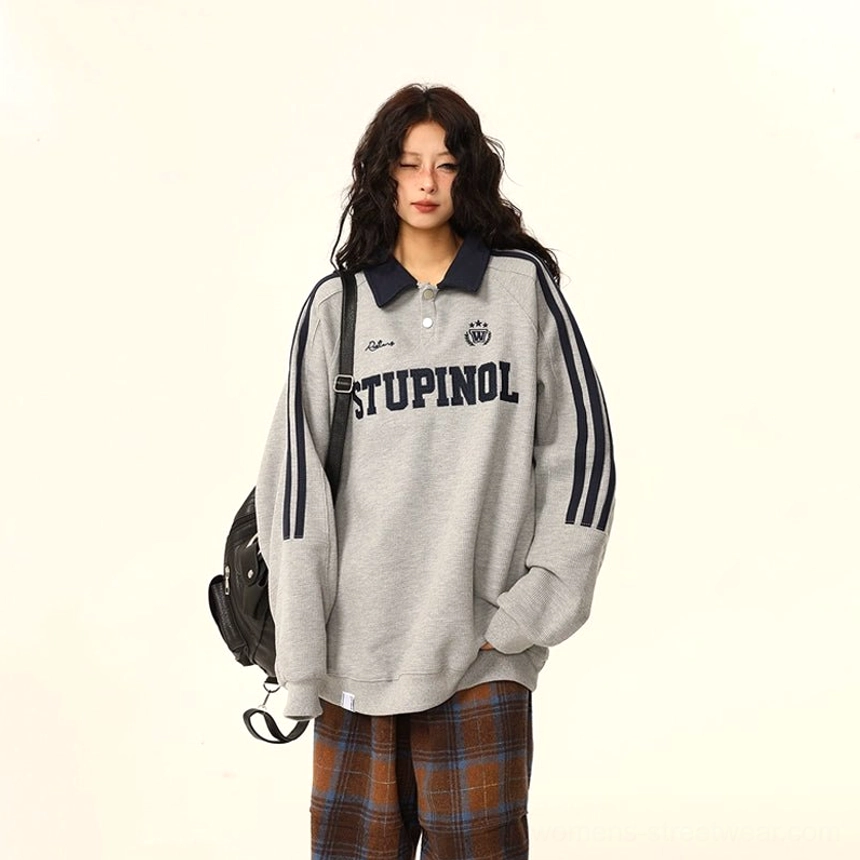 Varsity polo sweatshirt fashion detail with relaxed streetwear fit, contrast trim, and collegiate-inspired design