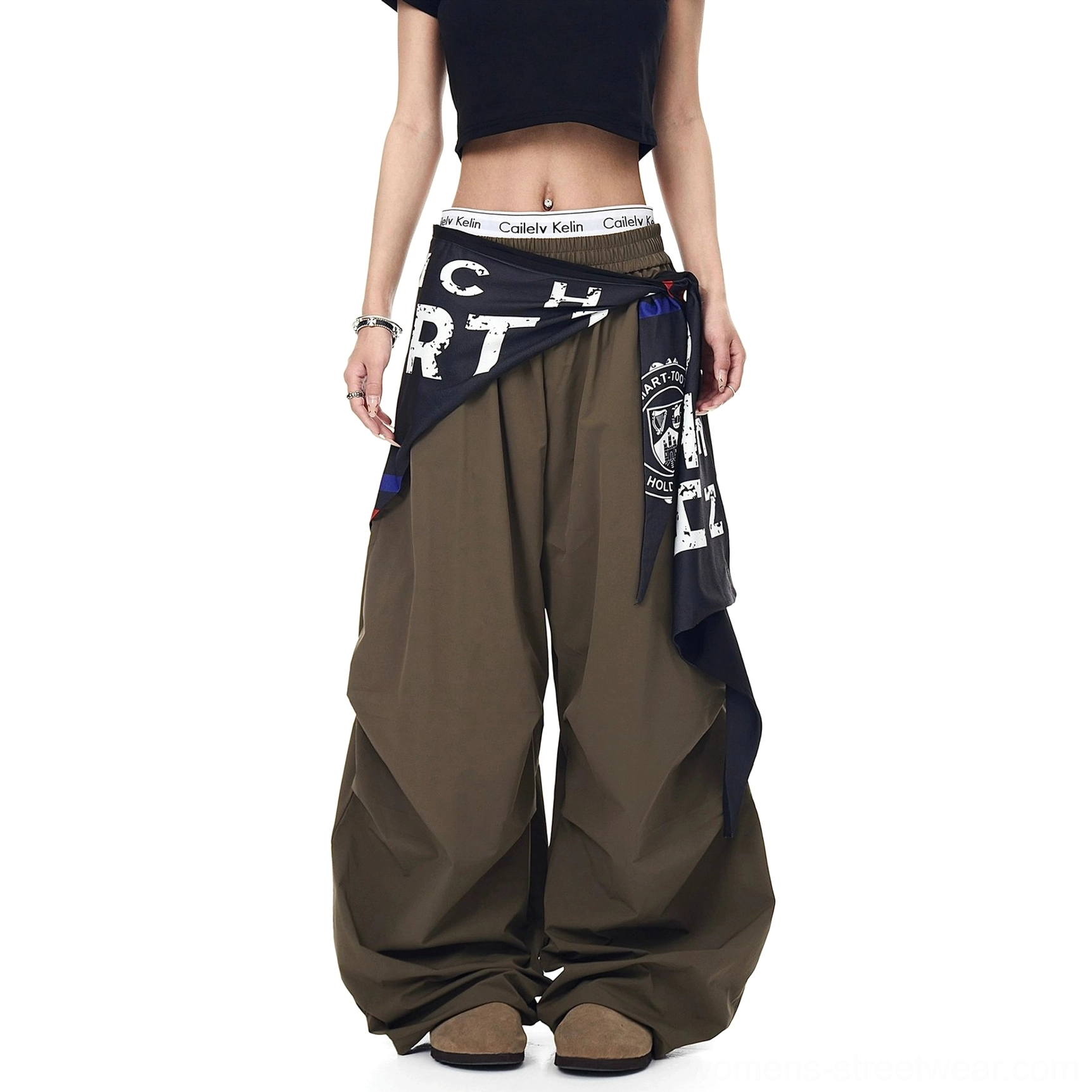 Statement parachute cargo pants with varsity-inspired scarf layering, elastic waist, oversized legs, and contemporary Korean streetwear styling