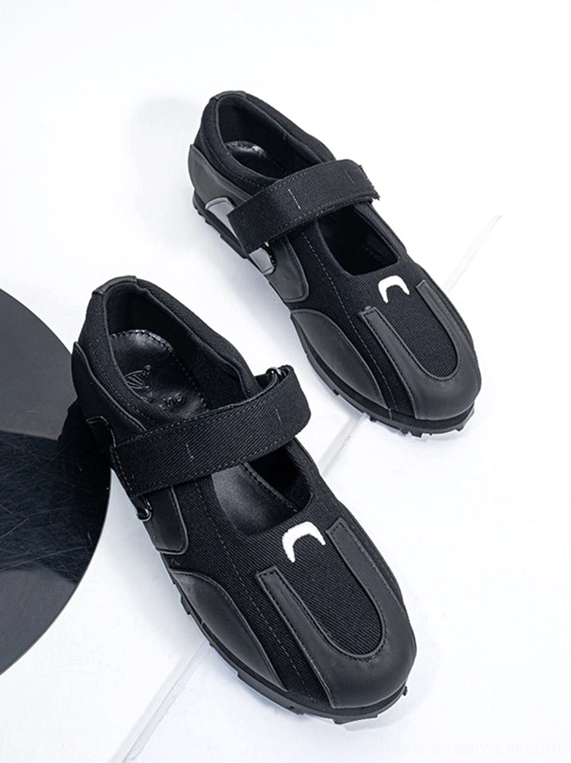 Pair of all-black sport ballet Mary Jane sneakers with wide adjustable Velcro straps top view