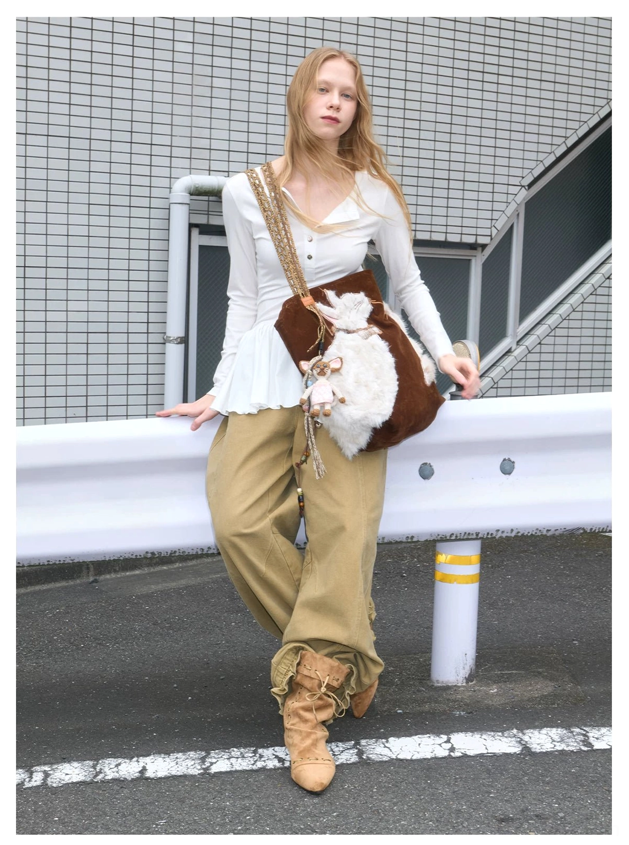 Velvet cat plush shoulder tote worn with neutral casual clothing, mixed cat motifs, and textured leather trim