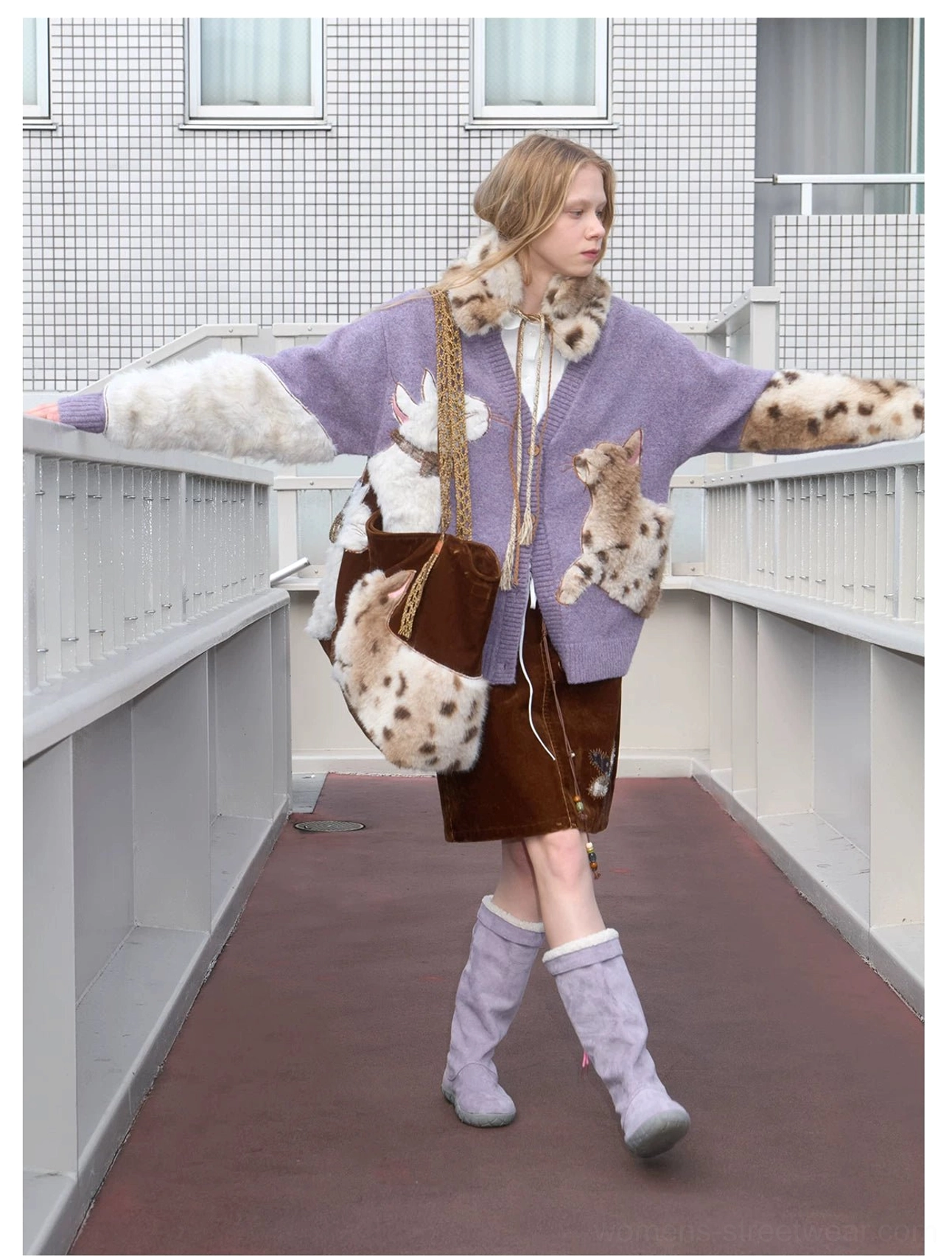 Velvet cat plush tote bag carried with a coordinated cozy fall outfit, dual cat details, and classic structured tote shape