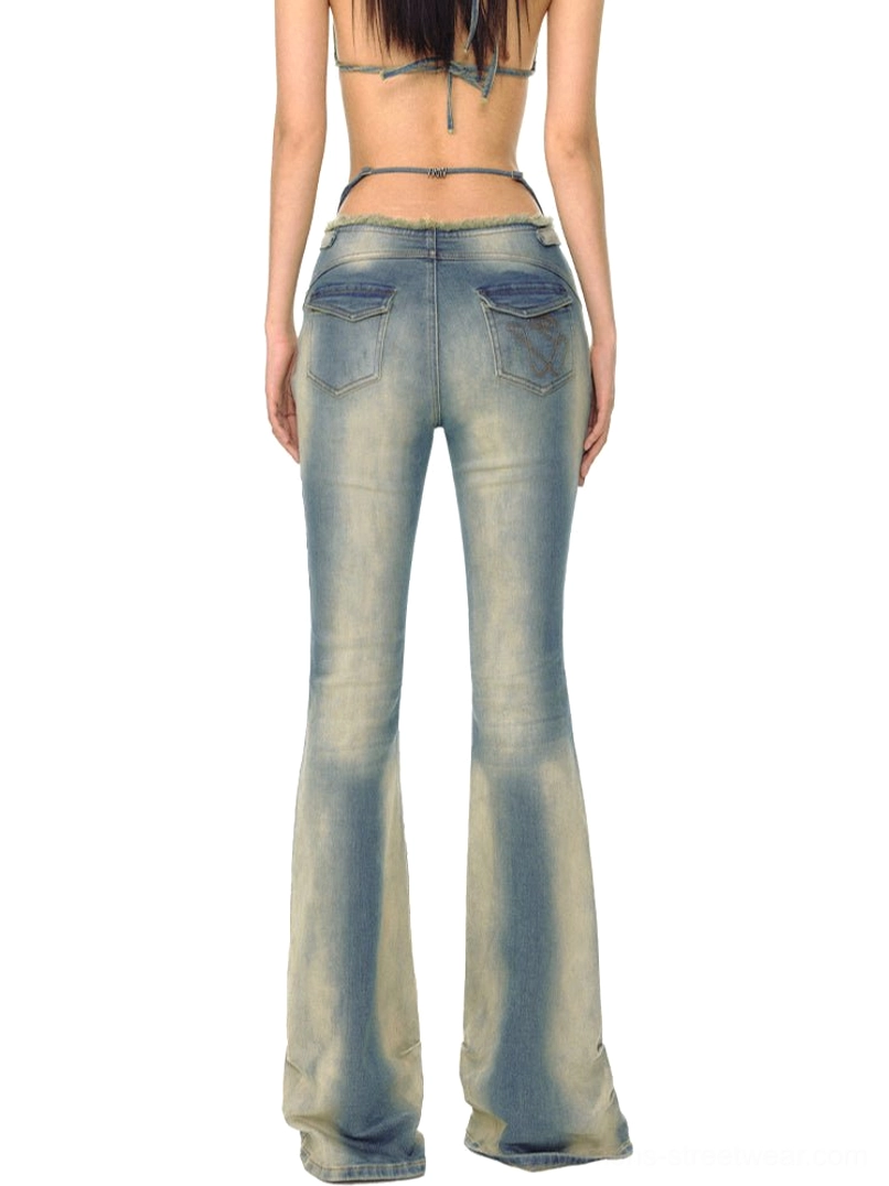 Vintage acid wash flared jeans shown from the back with decorative stitched pockets and low-rise waist
