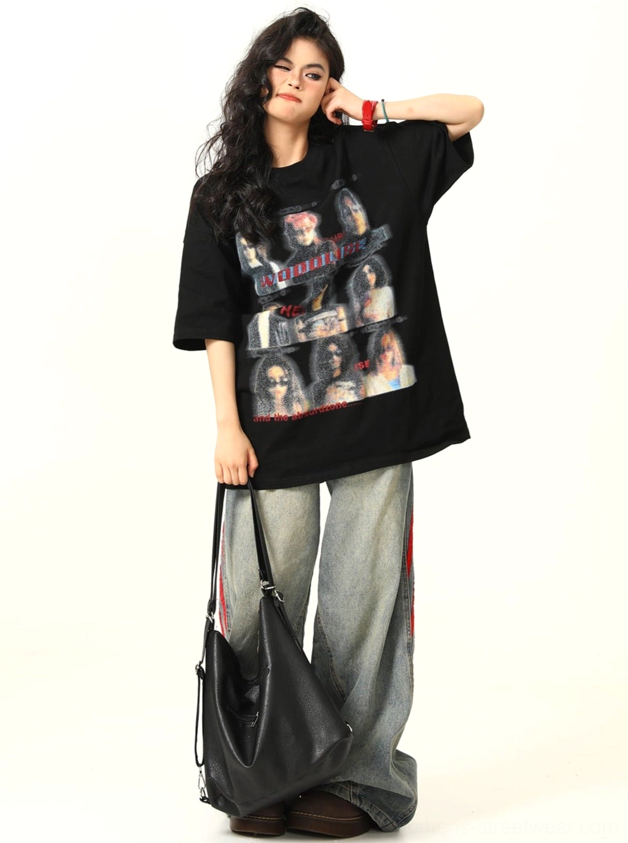 Black vintage graphic band tee with oversized fit paired with denim and shoulder bag