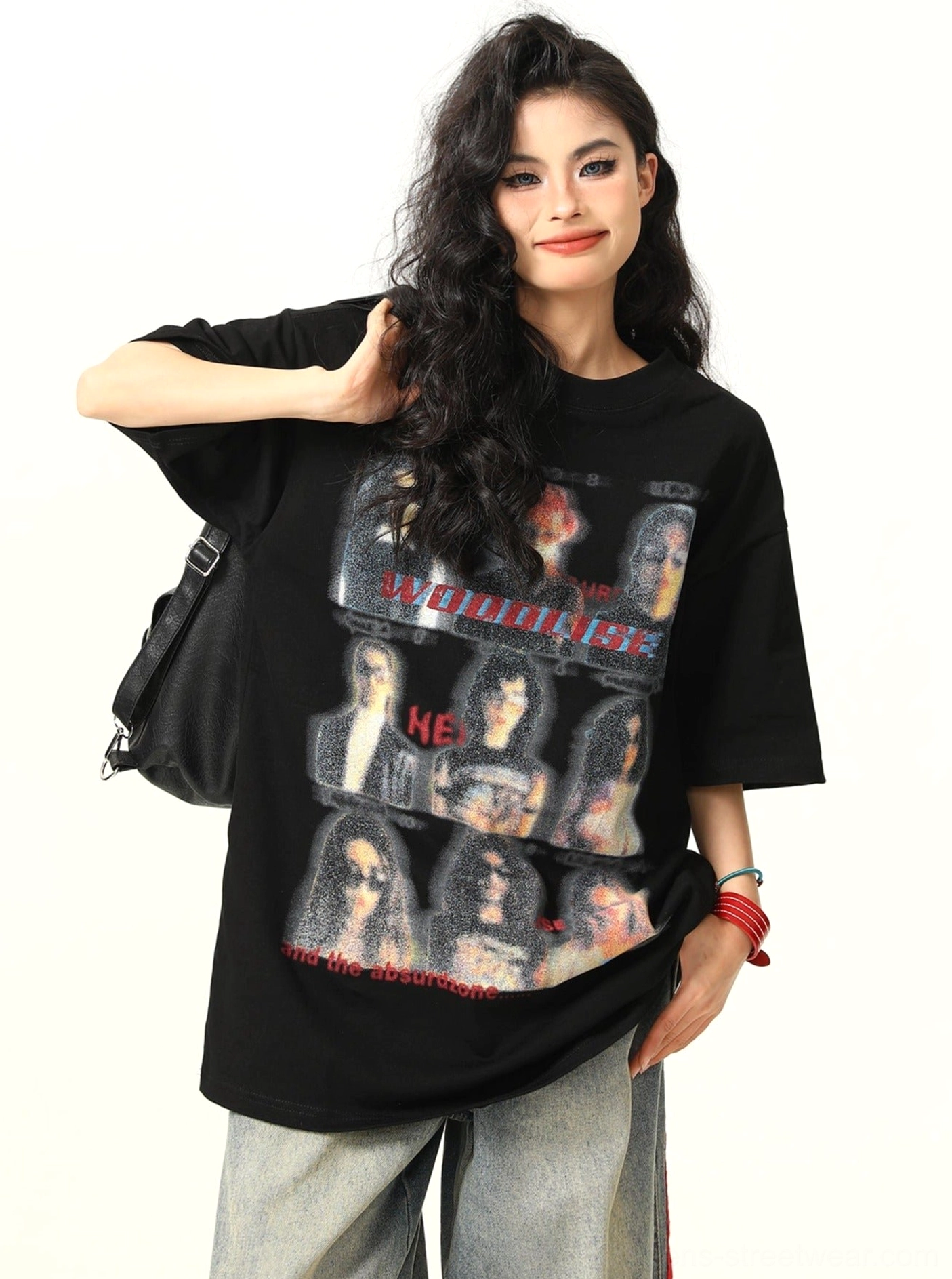 Side view of black vintage band graphic oversized streetwear t-shirt with loose short sleeves