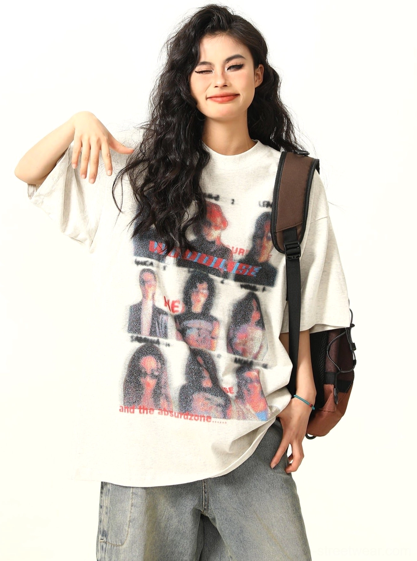 Gray oversized vintage band t-shirt side view showing dropped shoulders and loose streetwear silhouette