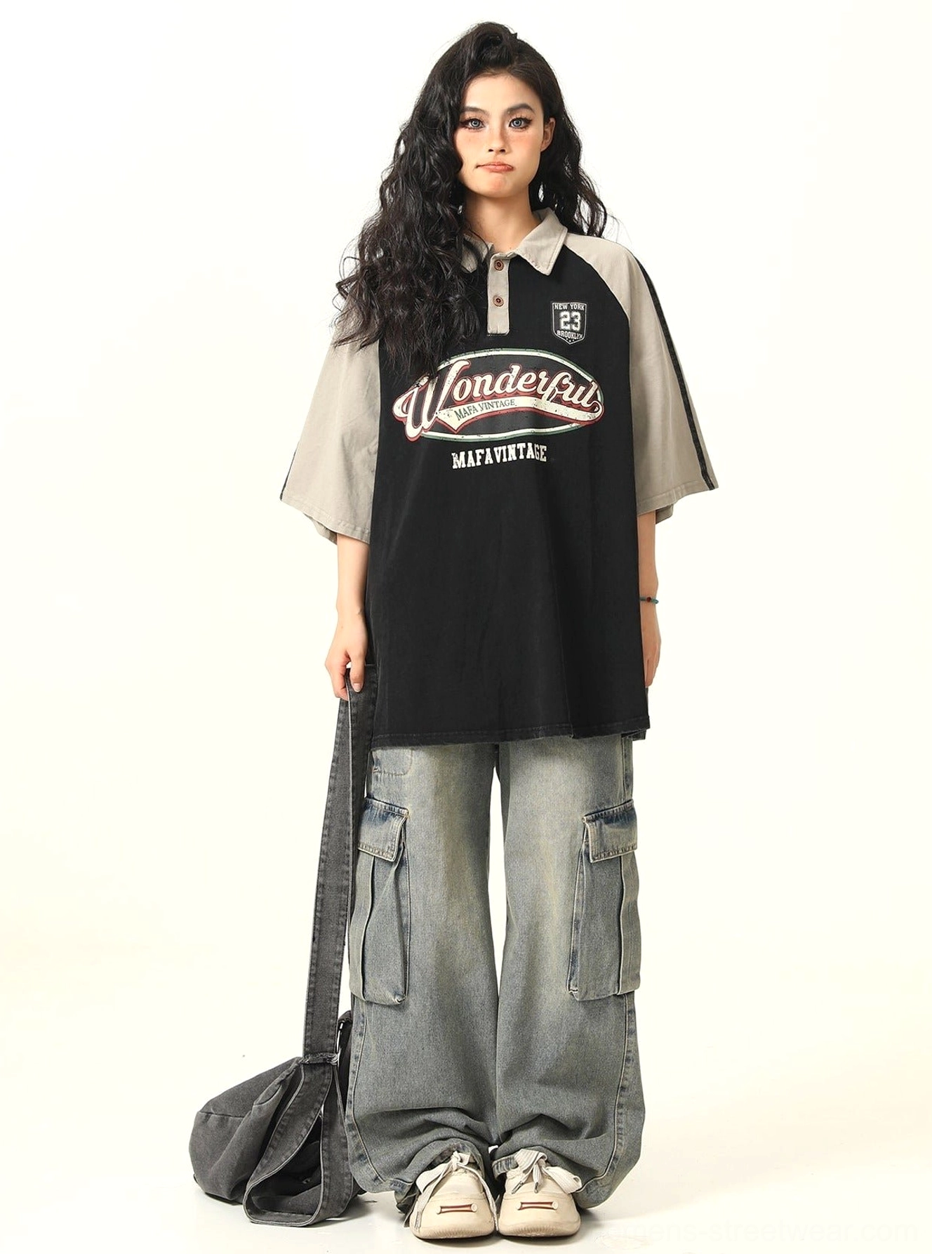 Vintage oversized black polo shirt with grey raglan sleeves styled with cargo jeans, sneakers, and canvas tote for Seoul street fashion