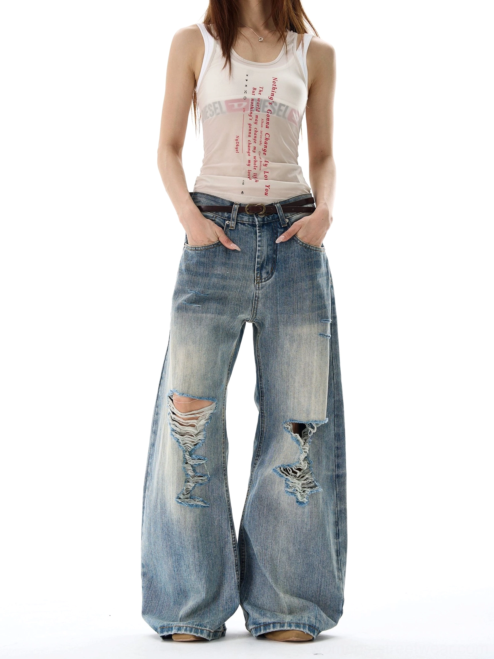 Vintage blue heavy distressed wide leg denim jeans front full body view with ripped knees