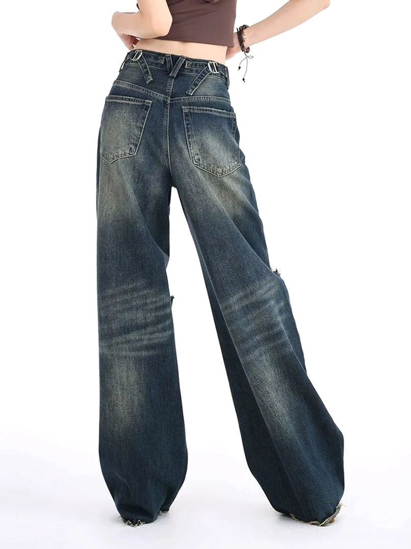 Rear full-body view of vintage blue high-waisted wide leg jeans showing classic back pockets, dark washed denim, relaxed streetwear silhouette, and clean back design