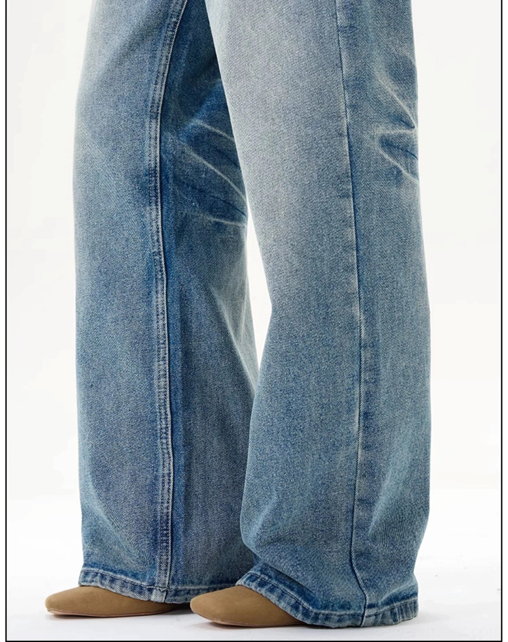 Vintage blue wash wide-leg streetwear jeans with relaxed baggy silhouette and faded denim texture