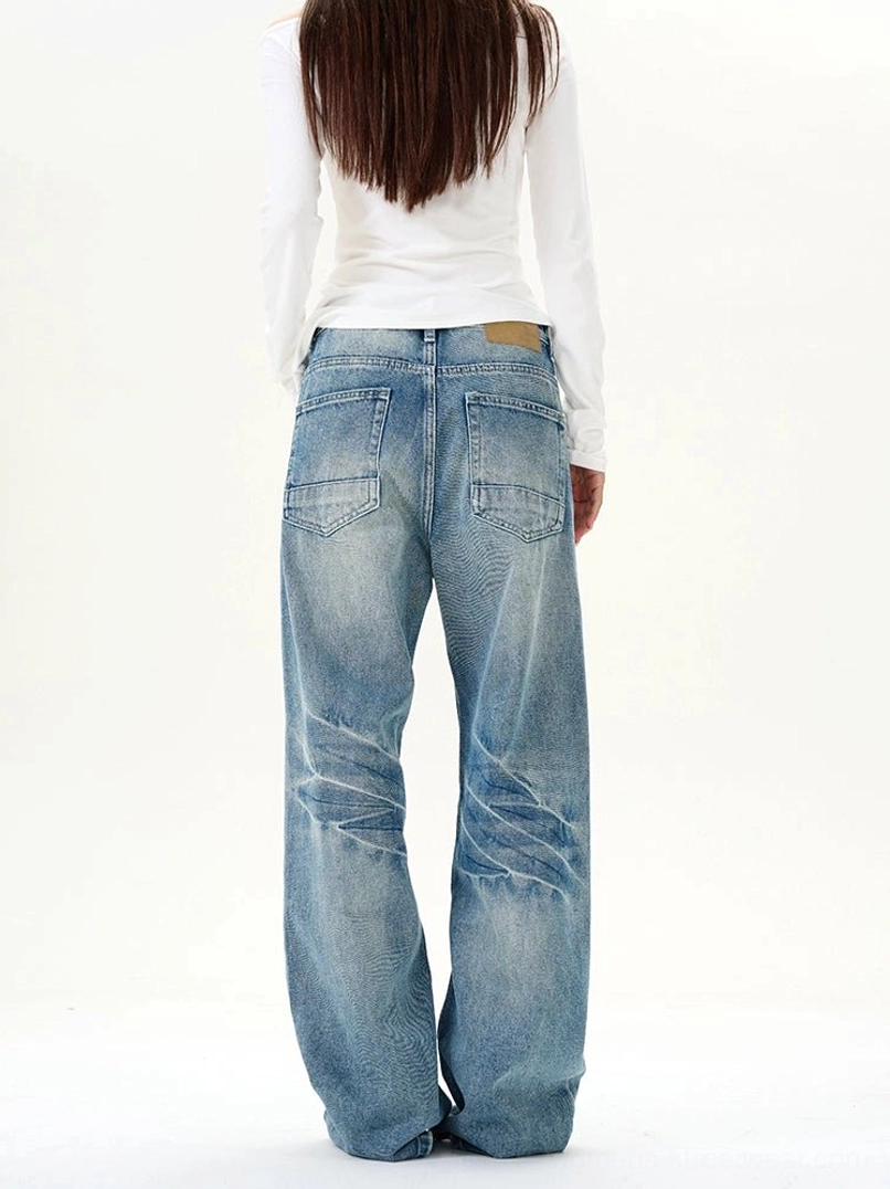Rear view of vintage blue wide-leg jeans with dual back pockets, faded denim coloring, and relaxed streetwear fit